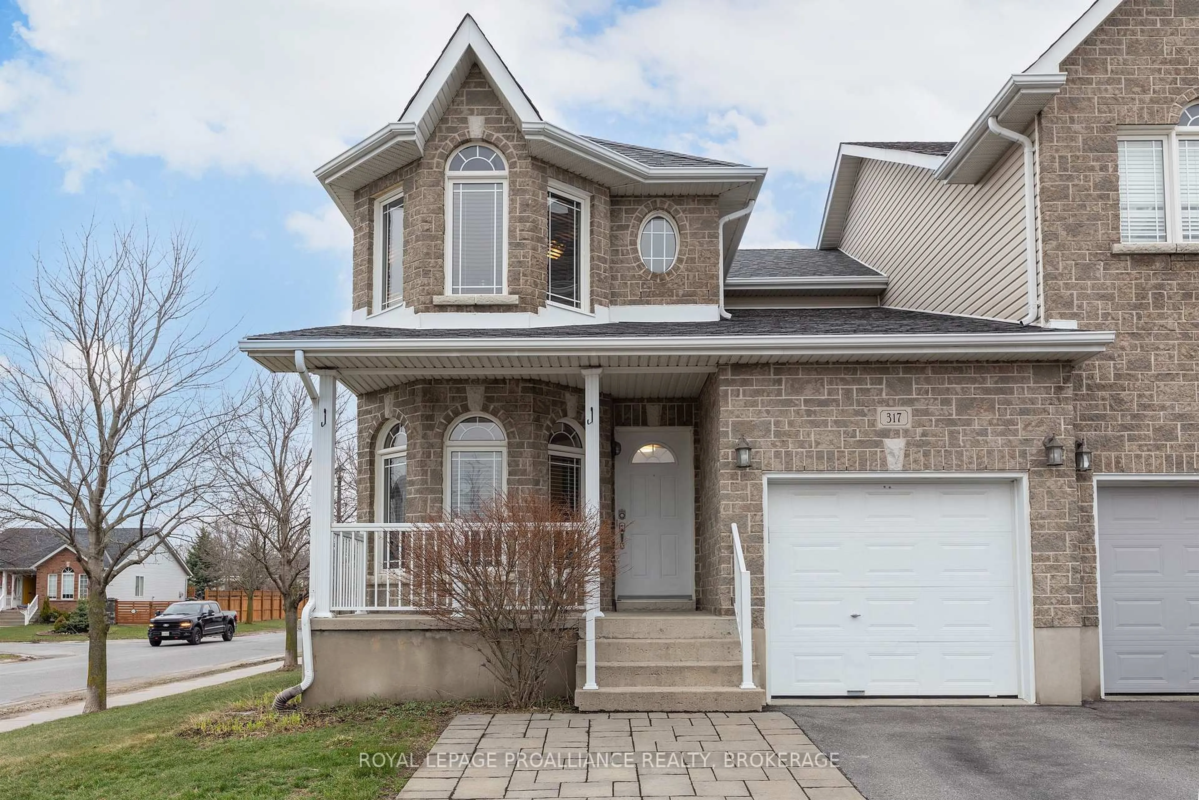 Home with brick exterior material, street for 317 Rose Abbey Dr, Kingston Ontario K7K 0A4