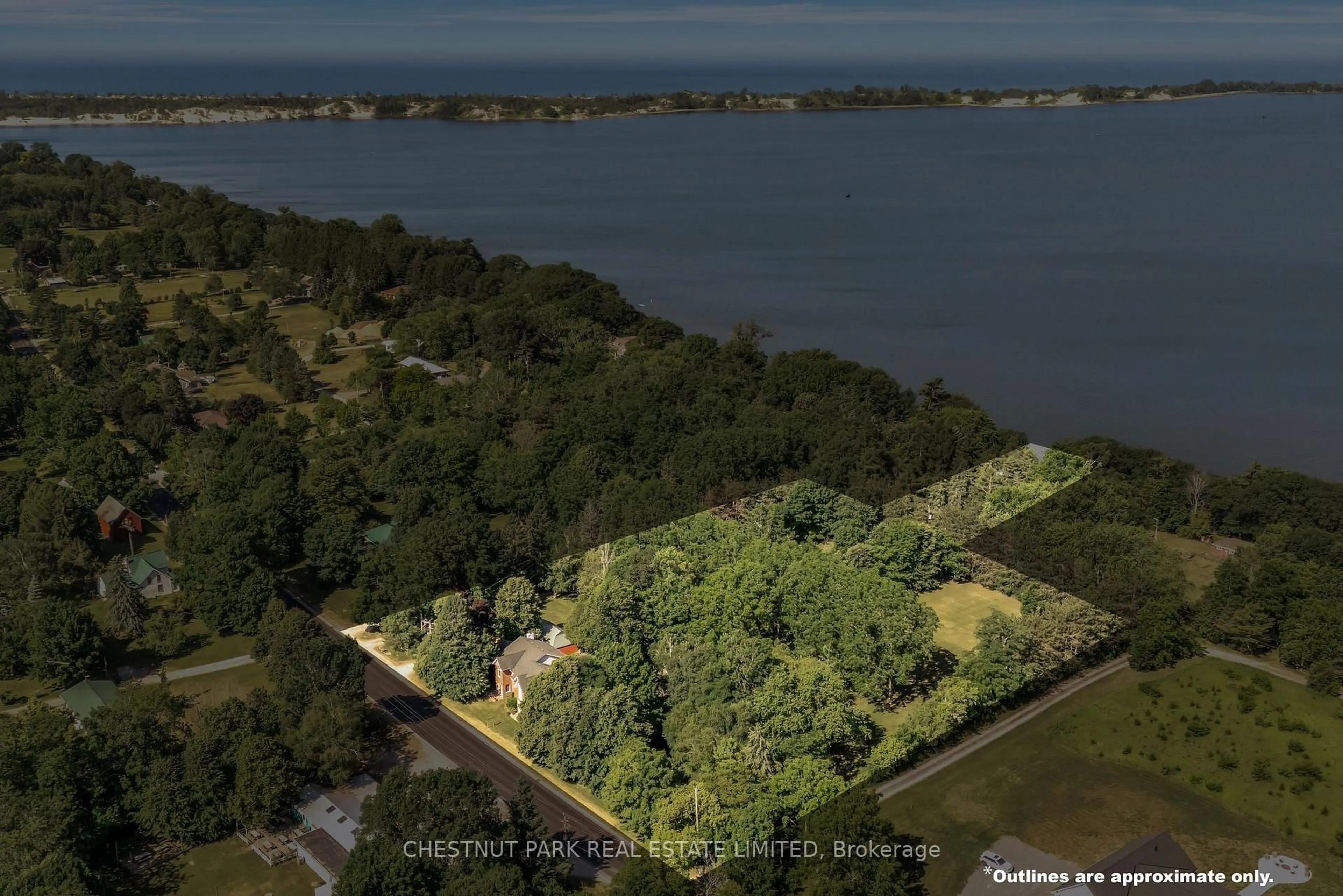 A pic from outside/outdoor area/front of a property/back of a property/a pic from drone, water/lake/river/ocean view for 1716 County Rd 12, Prince Edward County Ontario K0K 2T0
