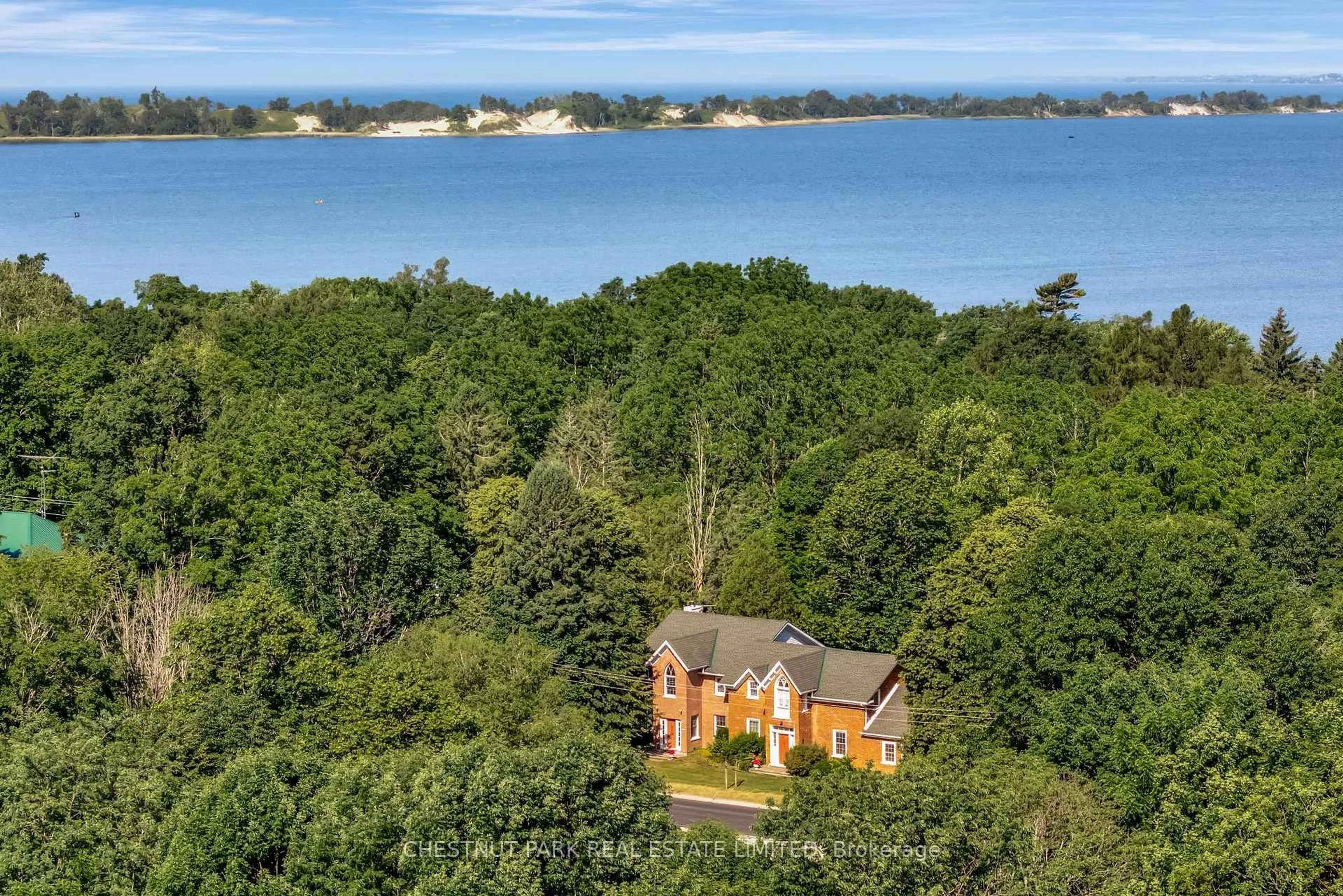 A pic from outside/outdoor area/front of a property/back of a property/a pic from drone, water/lake/river/ocean view for 1716 County Rd 12, Prince Edward County Ontario K0K 2T0