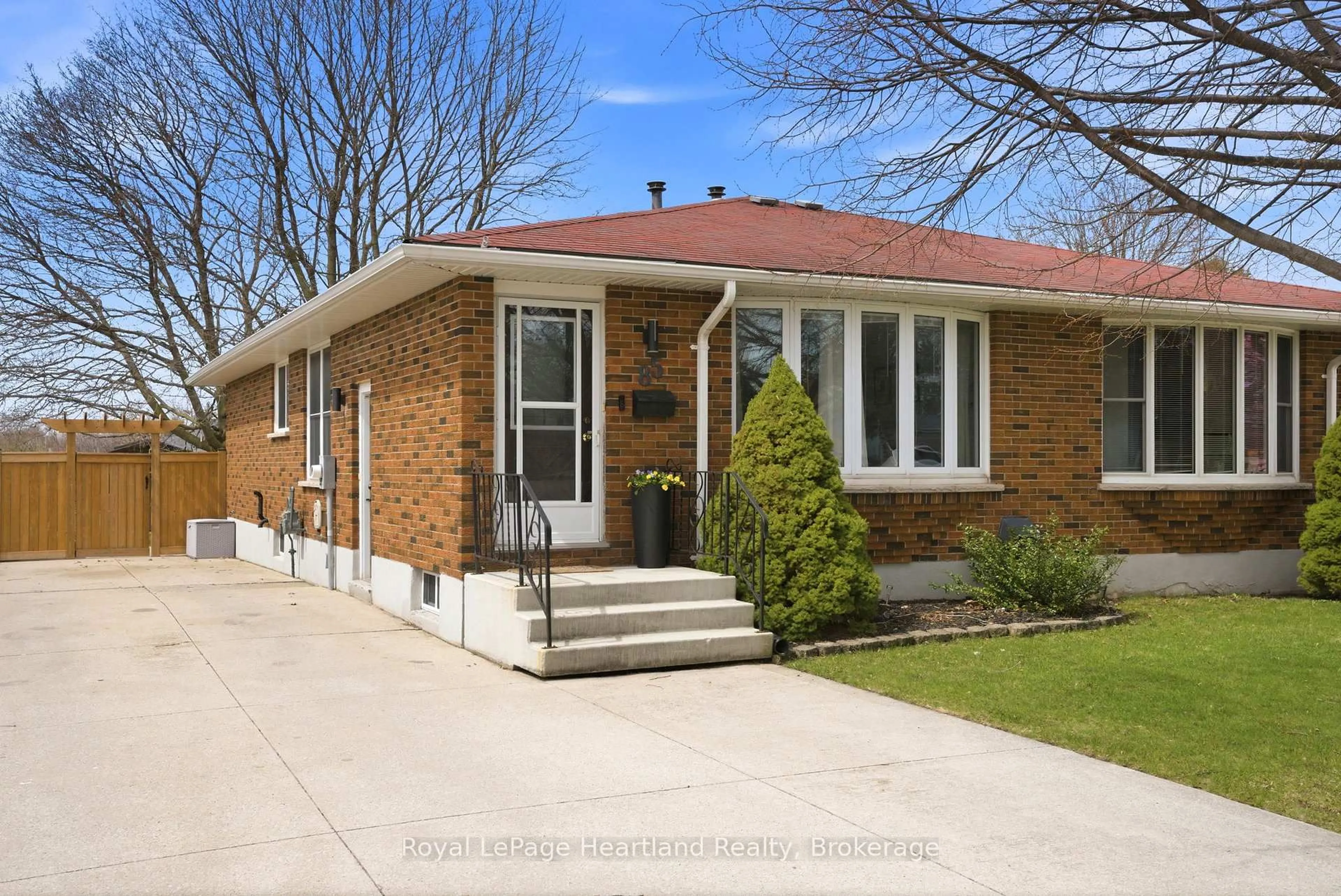 Home with brick exterior material, street for 85 Orchard St, South Huron Ontario N0M 1S3