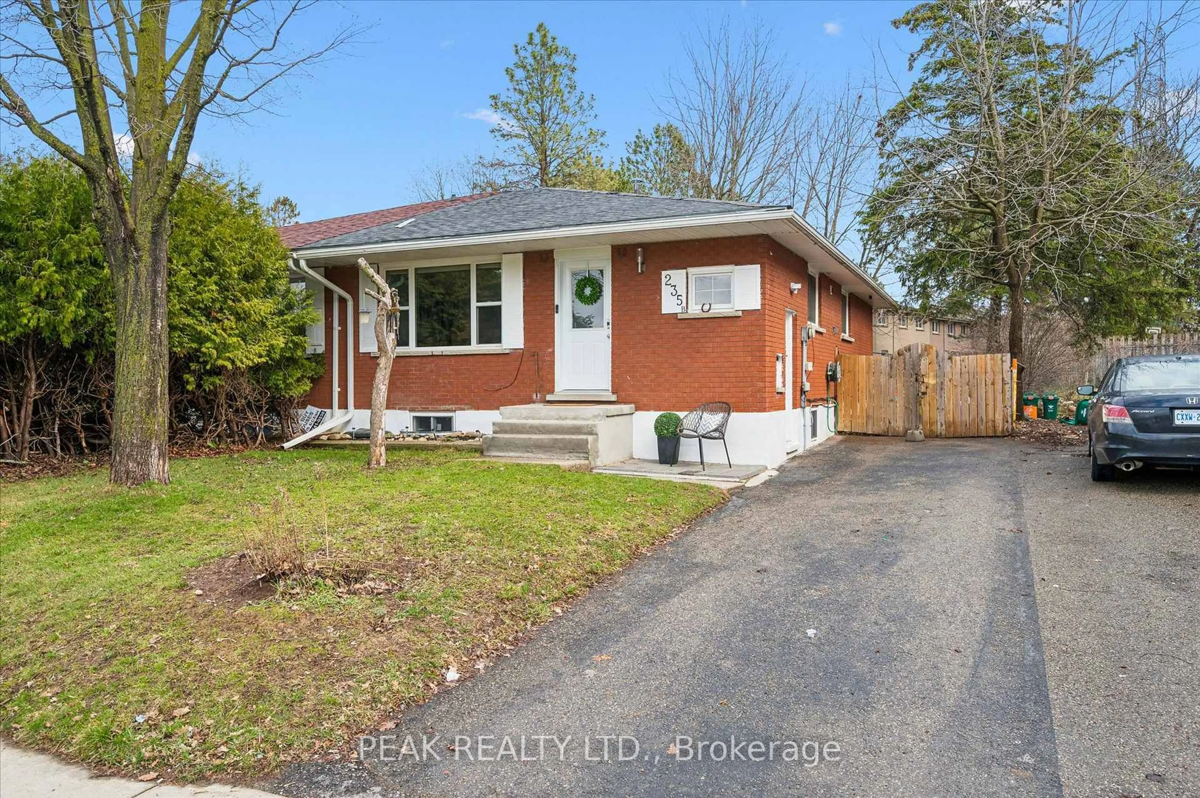 Home with brick exterior material, street for 235 CEDARBRAE Ave #B, Waterloo Ontario N2L 4S8