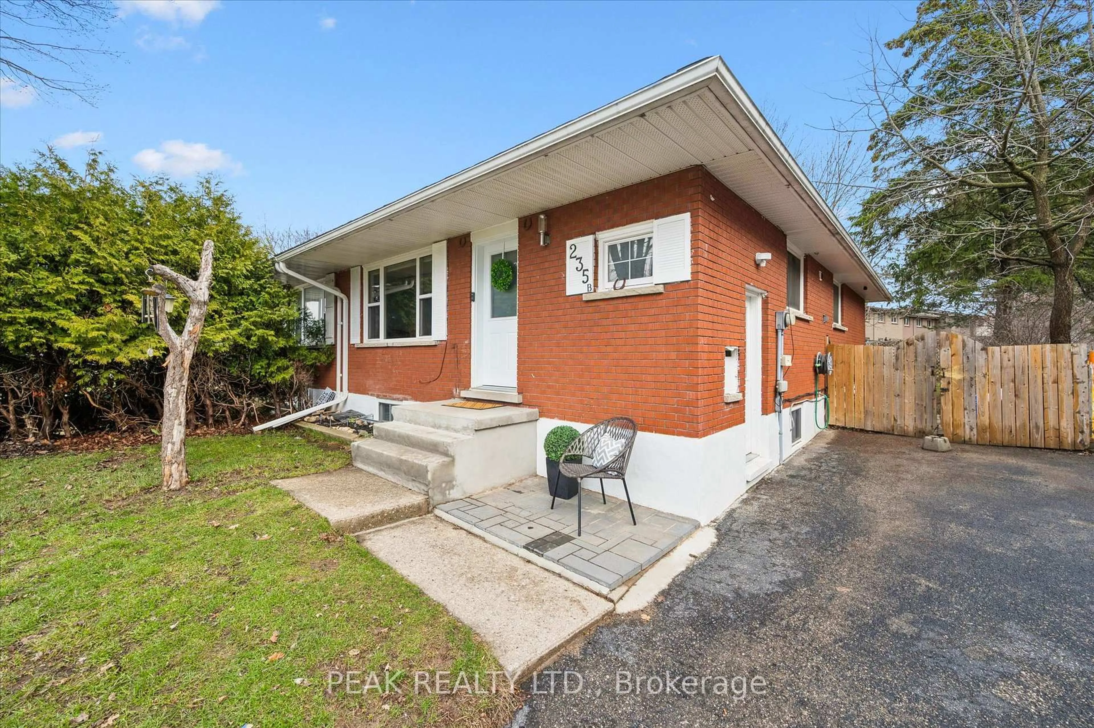 Home with brick exterior material, street for 235 CEDARBRAE Ave #B, Waterloo Ontario N2L 4S8