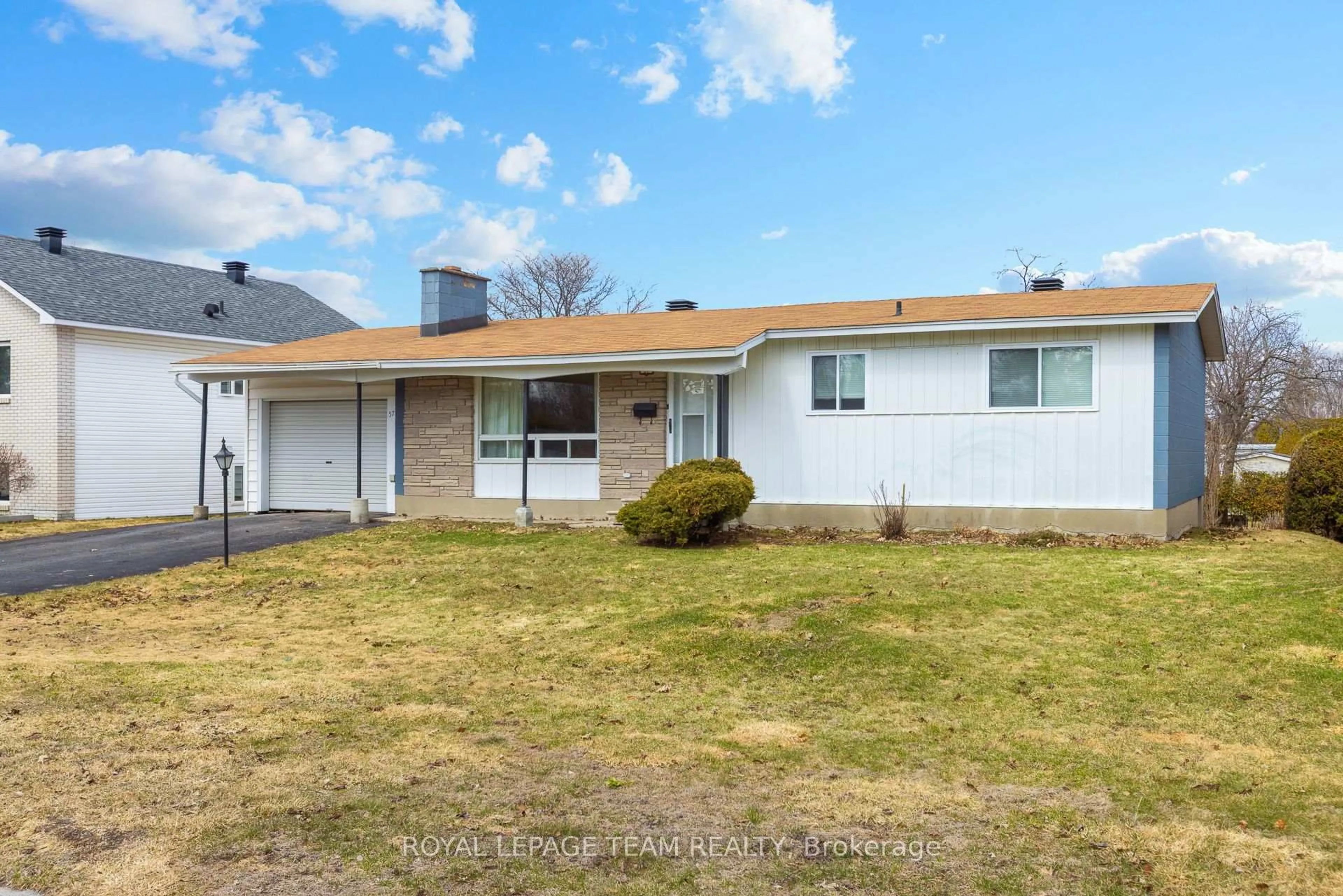 Home with vinyl exterior material, street for 57 Sullivan Ave, Ottawa Ontario K2G 1V1