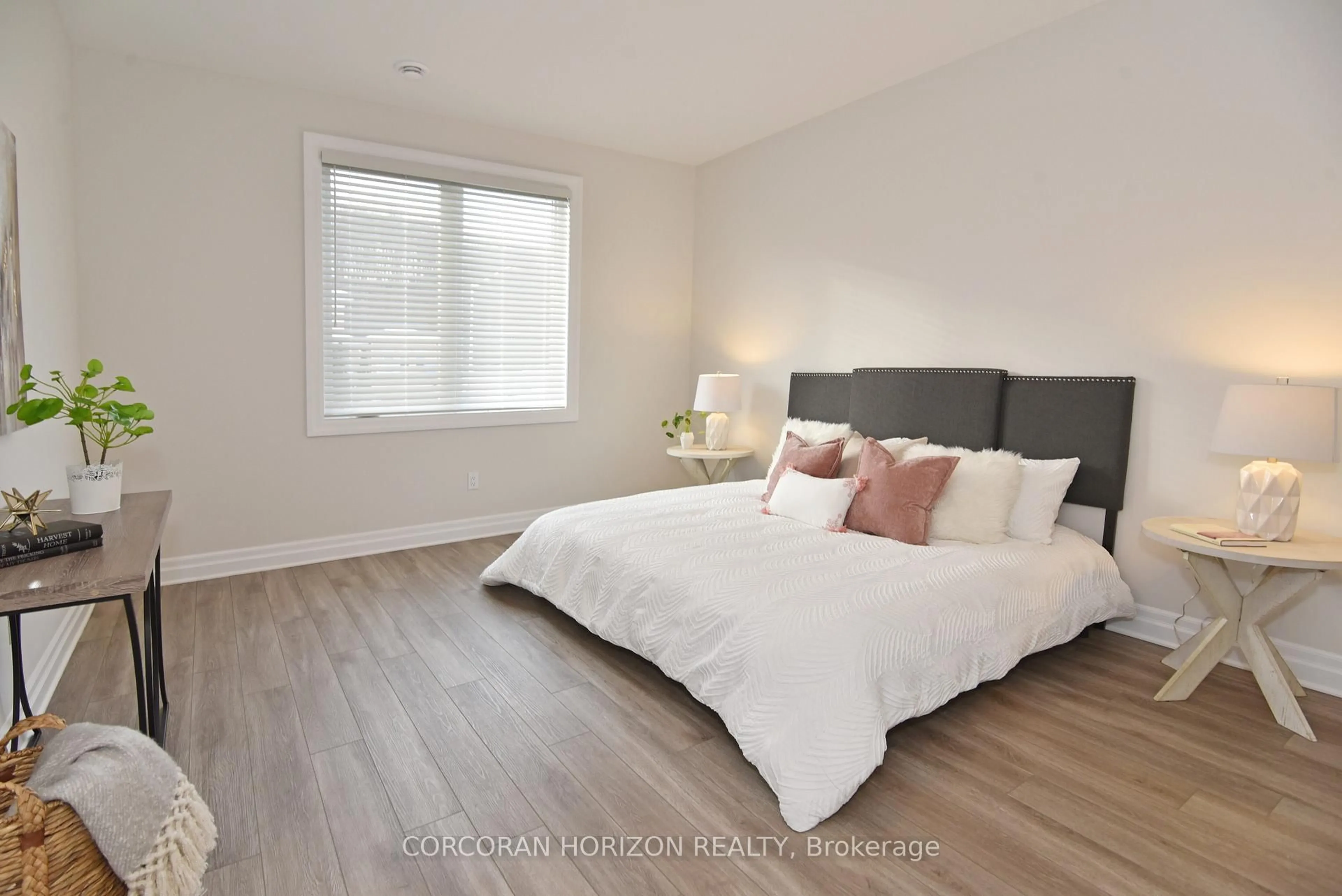 Bedroom with bed, wood/laminate floor for 403 Breakwater Blvd, Central Elgin Ontario N5L 0B5
