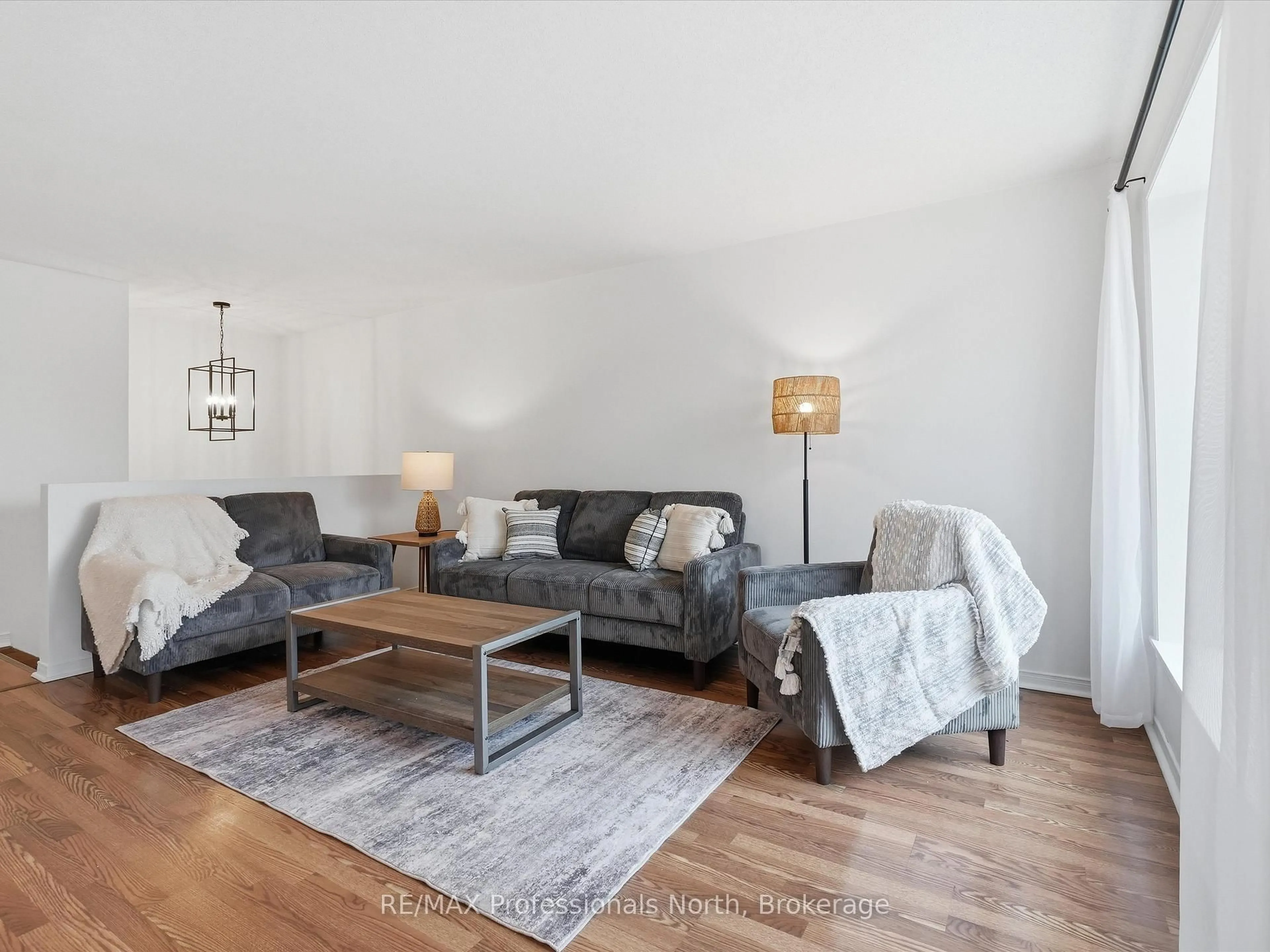 Living room with furniture, wood/laminate floor for 29 PINECONE DR., Bracebridge Ontario P1L 2G3