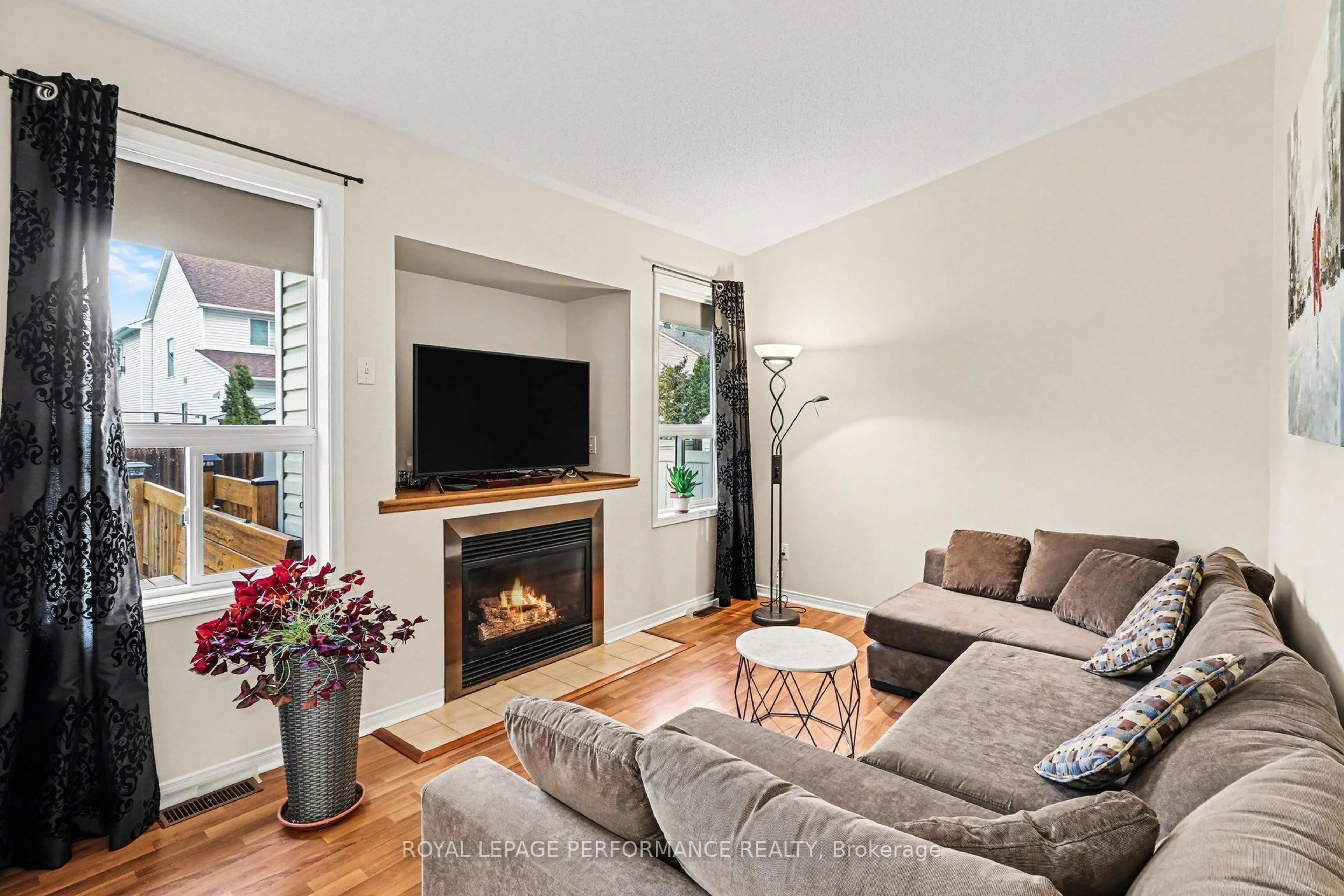 Living room with furniture, wood/laminate floor for 897 Paradise Cres, Ottawa Ontario K4A 3S5