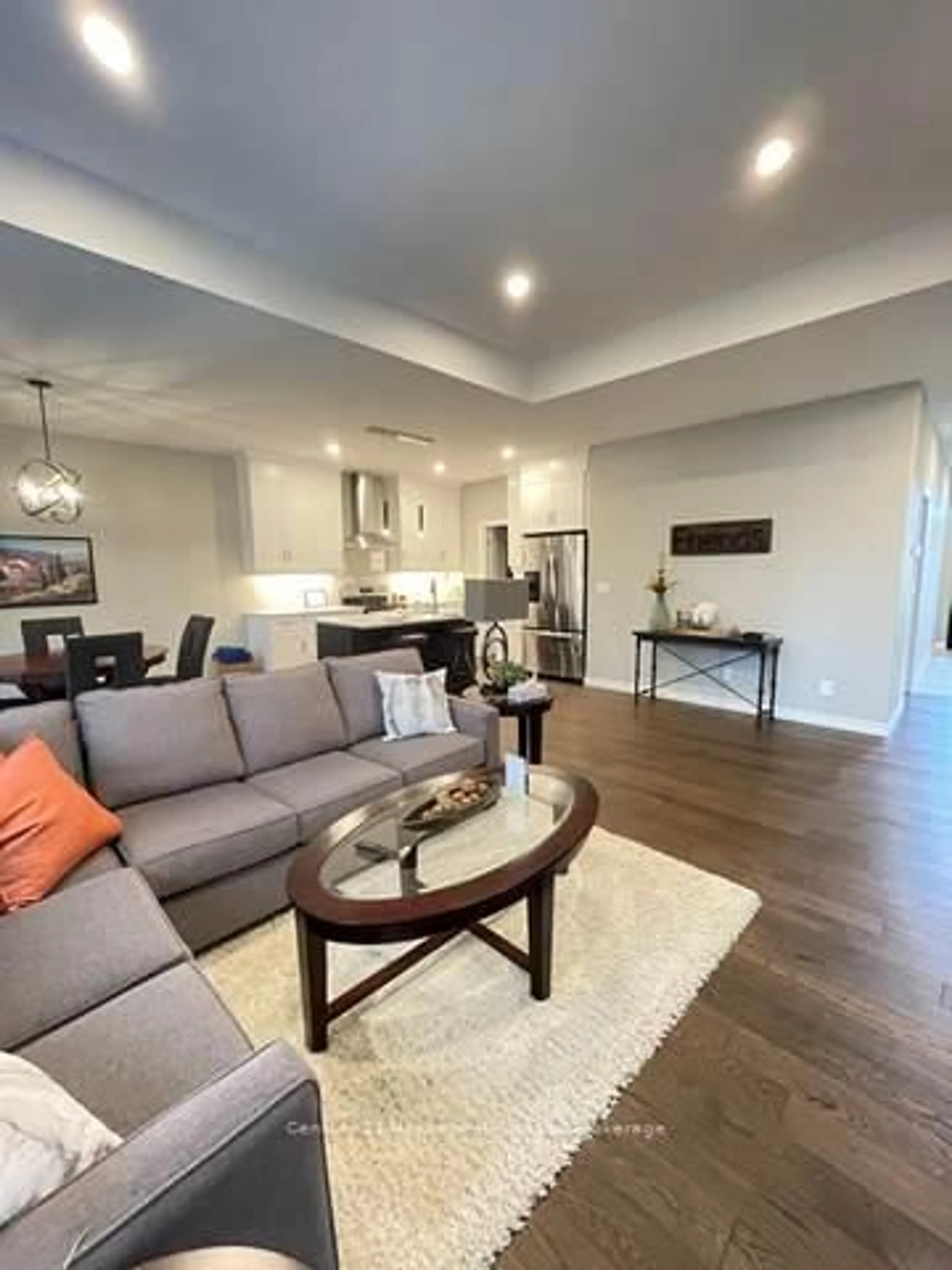 Living room with furniture, wood/laminate floor for 46 MATHESON Cres, East Zorra-Tavistock Ontario N0J 1M0