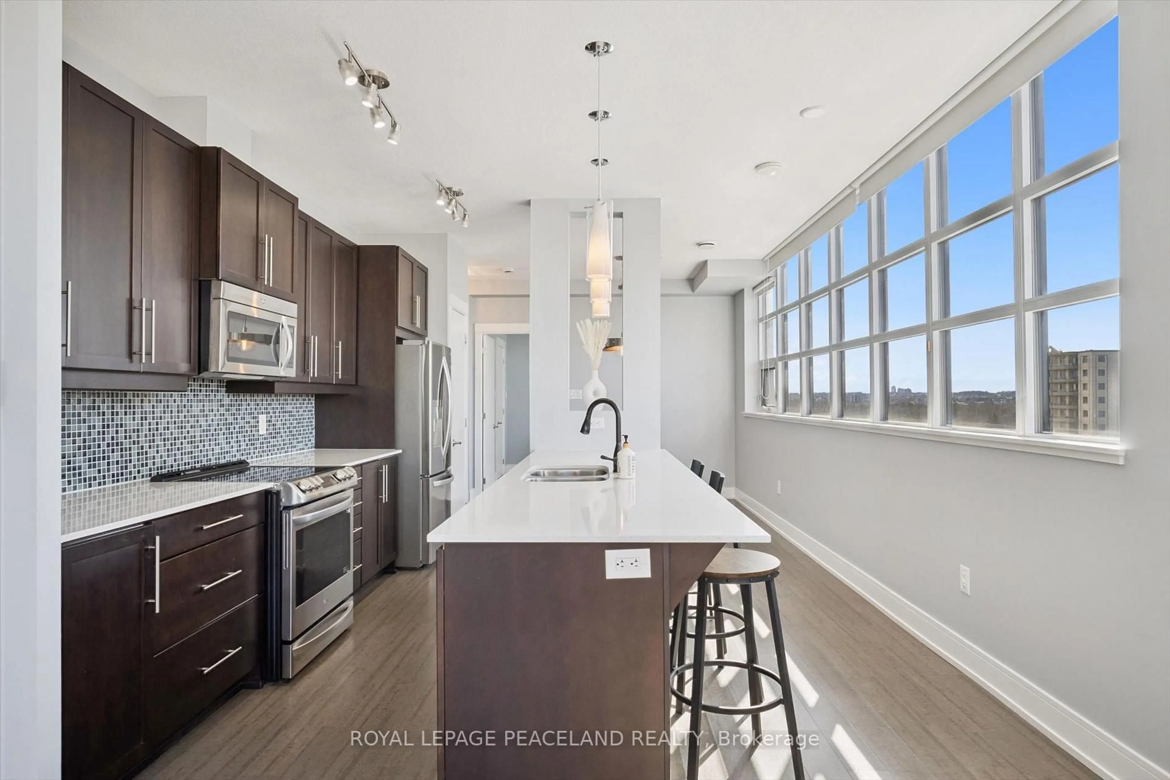 Open concept kitchen, ceramic/tile floor for 112 Benton St #610, Kitchener Ontario N2H 3H6