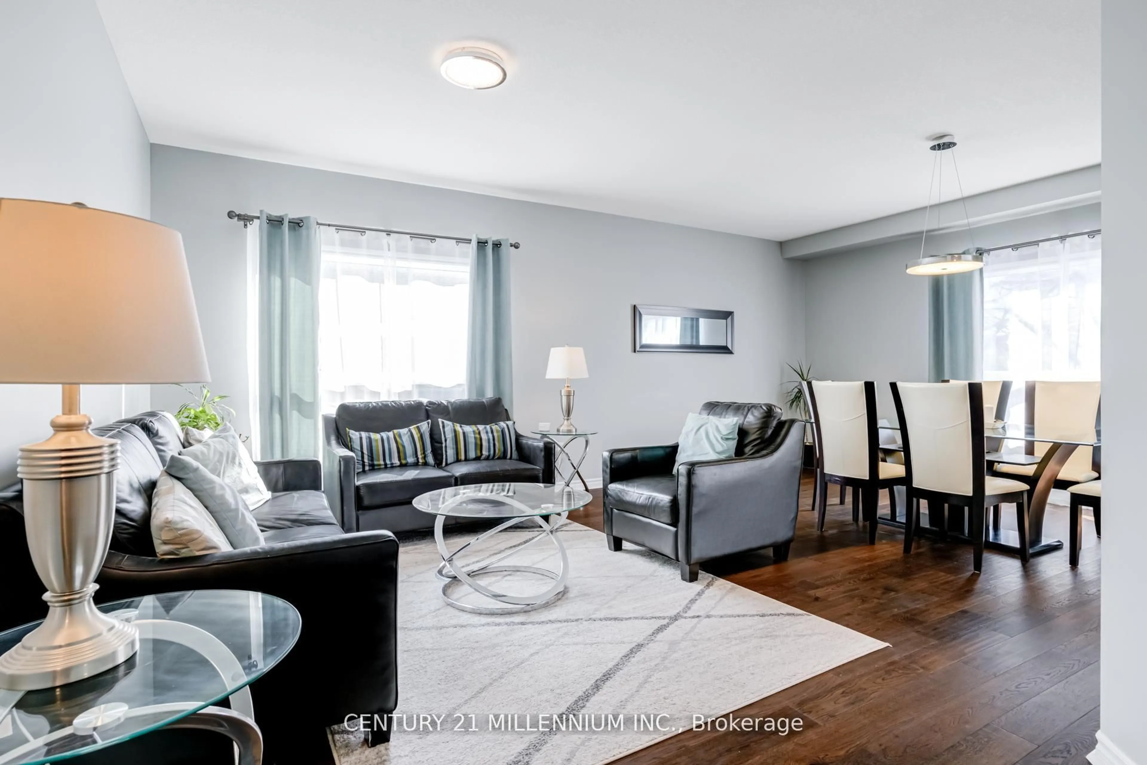 Living room with furniture, wood/laminate floor for 42 Frasson Dr, Guelph Ontario N1E 7J9