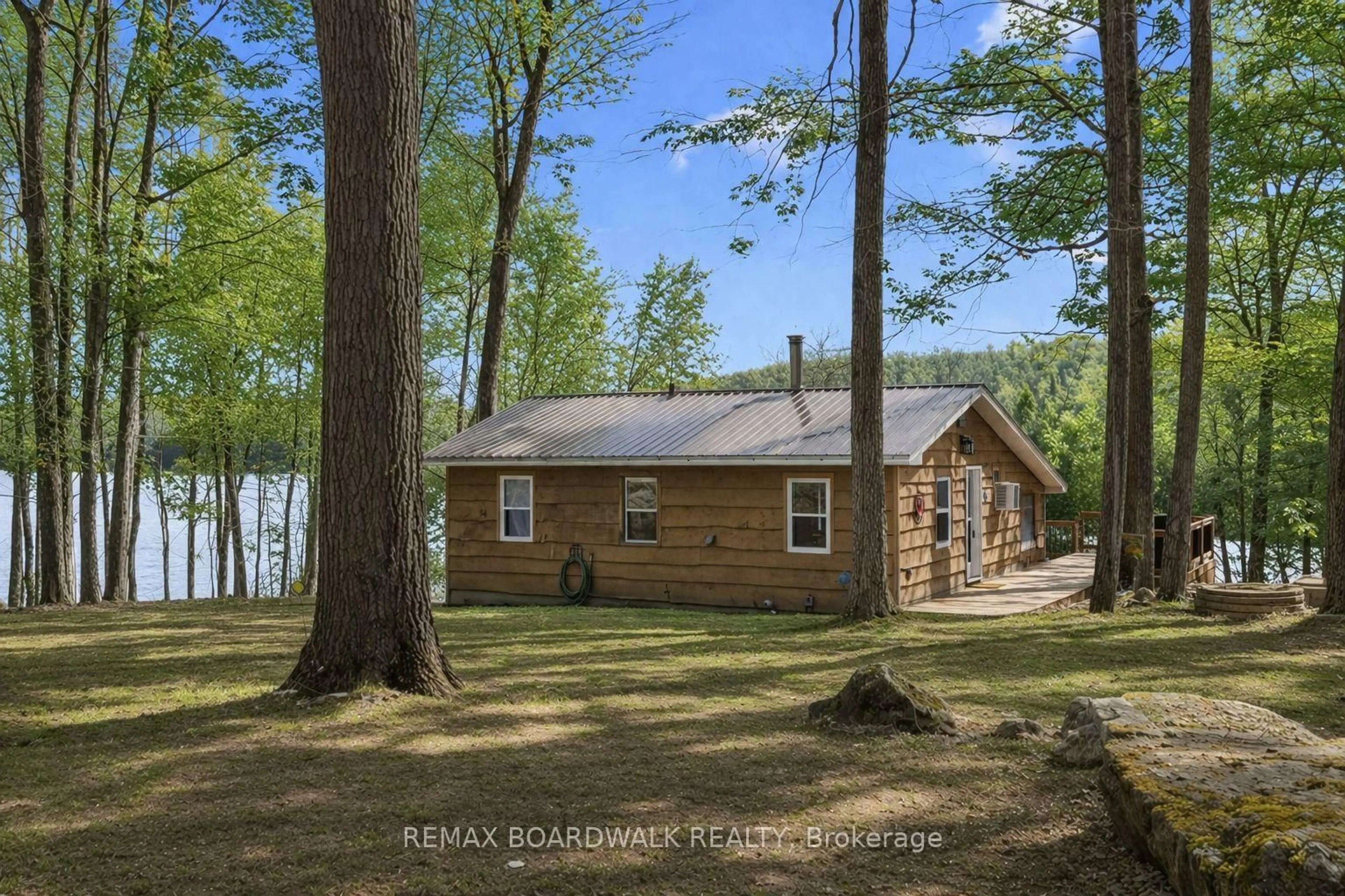 A pic from outside/outdoor area/front of a property/back of a property/a pic from drone, water/lake/river/ocean view for 116 Mill Bay Lane, Maberly Ontario K0H 2B0