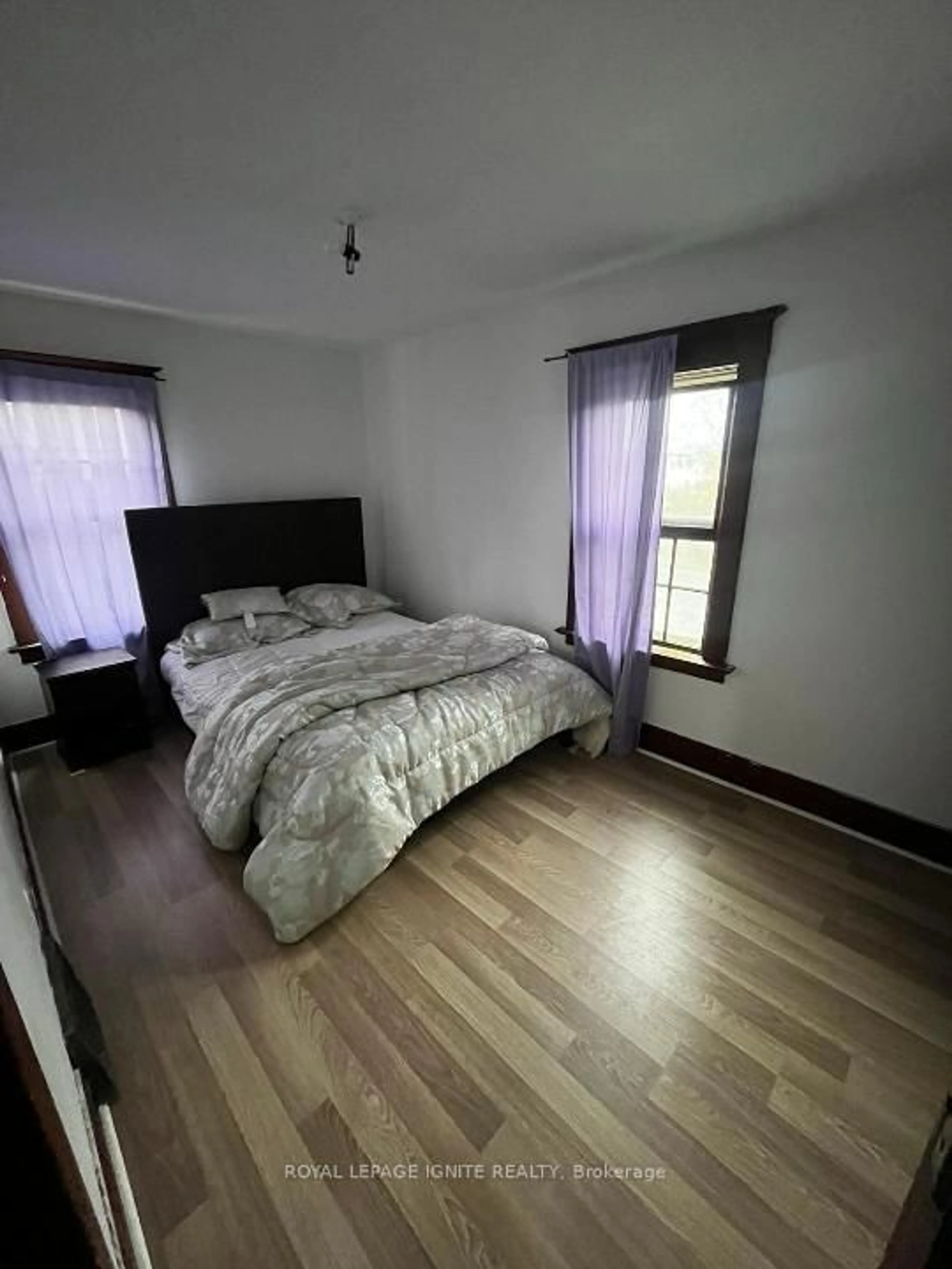 Bedroom with bed, wood/laminate floor for 6399 Thorold Stone Rd, Niagara Falls Ontario L2J 1A9