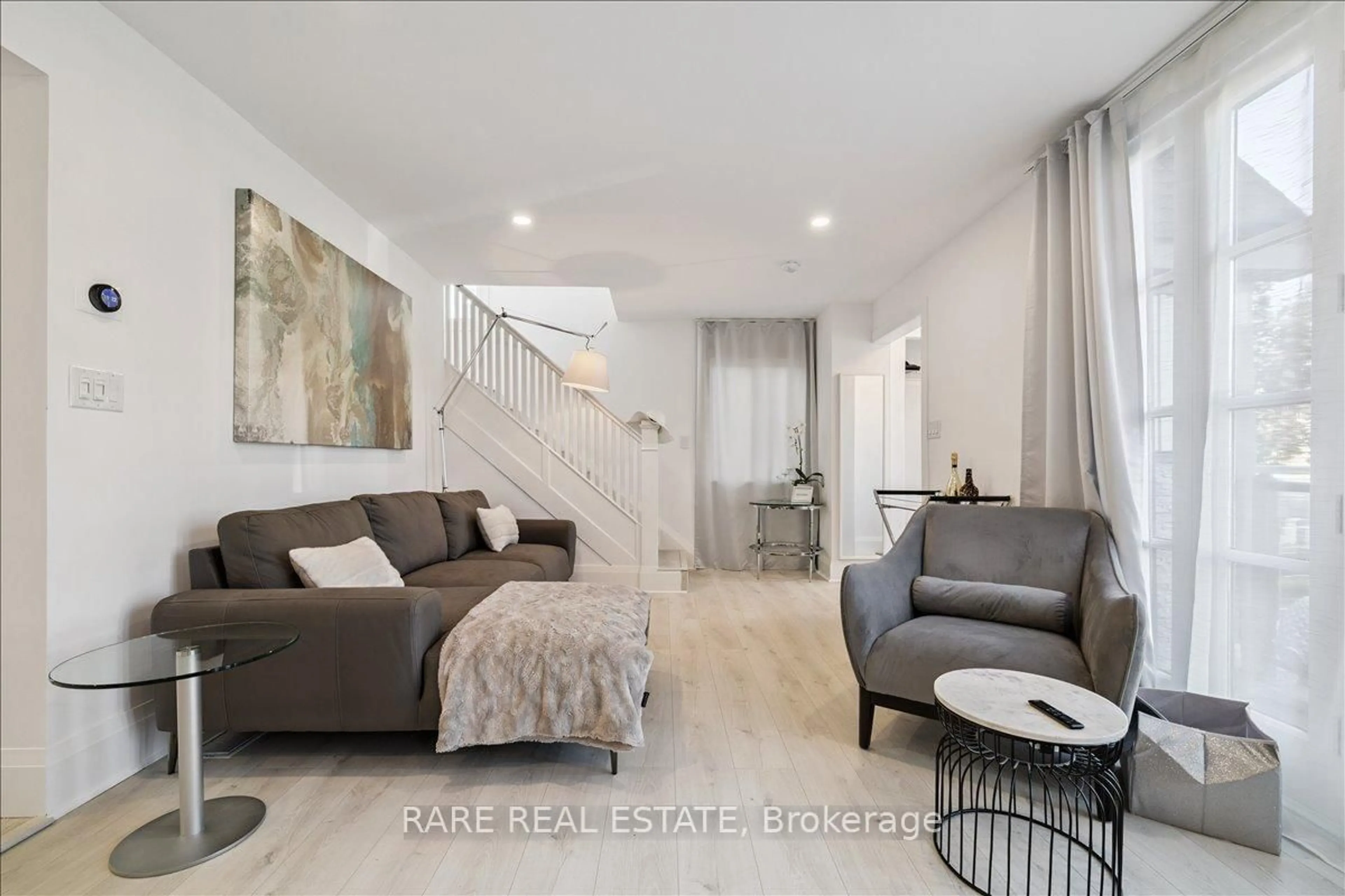 Living room with furniture, unknown for 5709 Dorchester Rd, Niagara Falls Ontario L2G 5S5