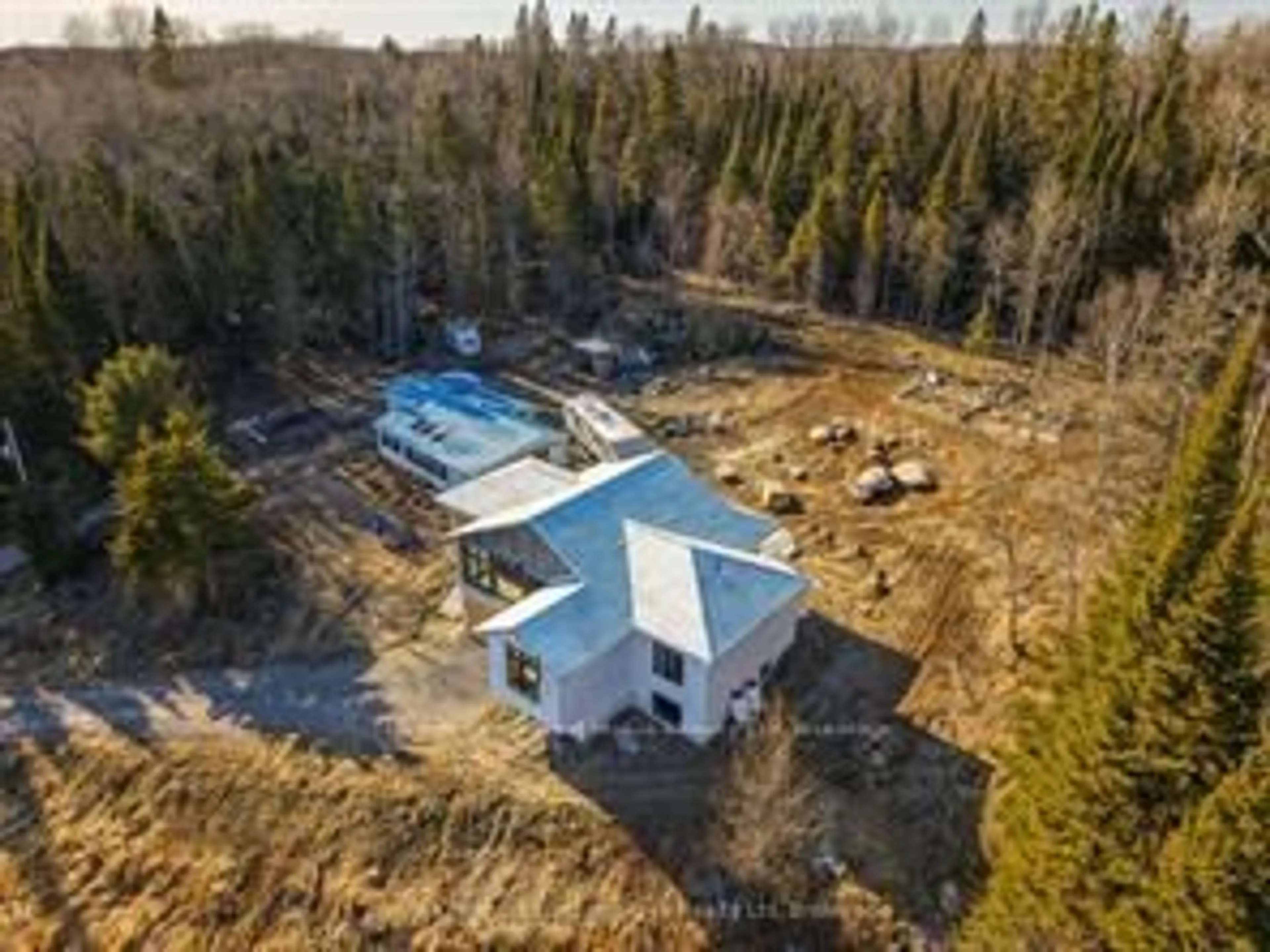 A pic from outside/outdoor area/front of a property/back of a property/a pic from drone, building for 556 Highway 518, Perry Ontario P0A 1J0