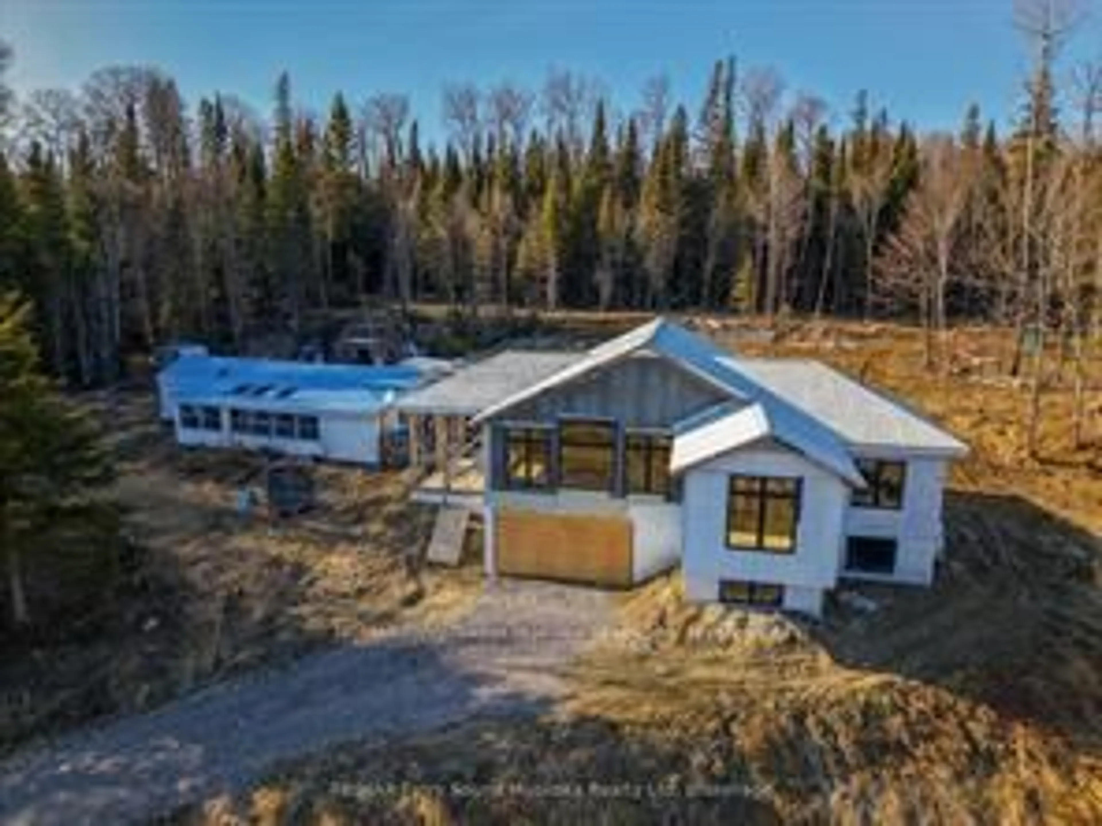 A pic from outside/outdoor area/front of a property/back of a property/a pic from drone, mountain view for 556 Highway 518, Perry Ontario P0A 1J0