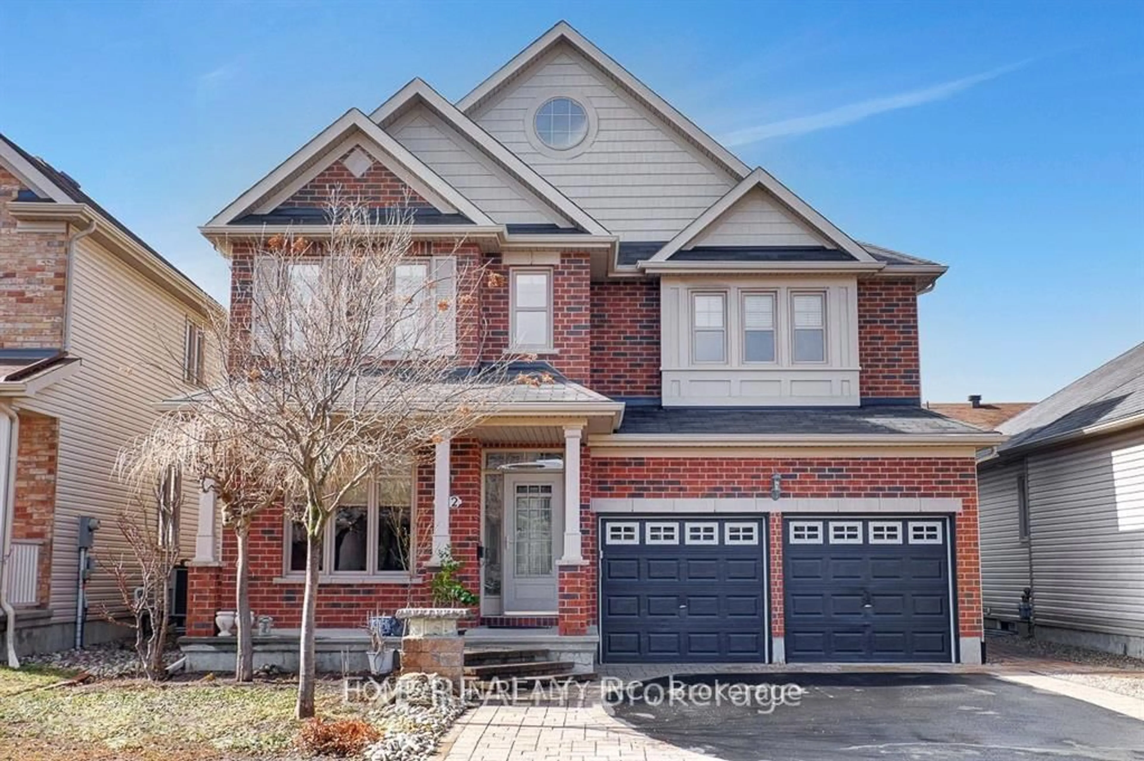 Home with brick exterior material, street for 122 Rodeo Dr, Barrhaven Ontario K2J 5K3