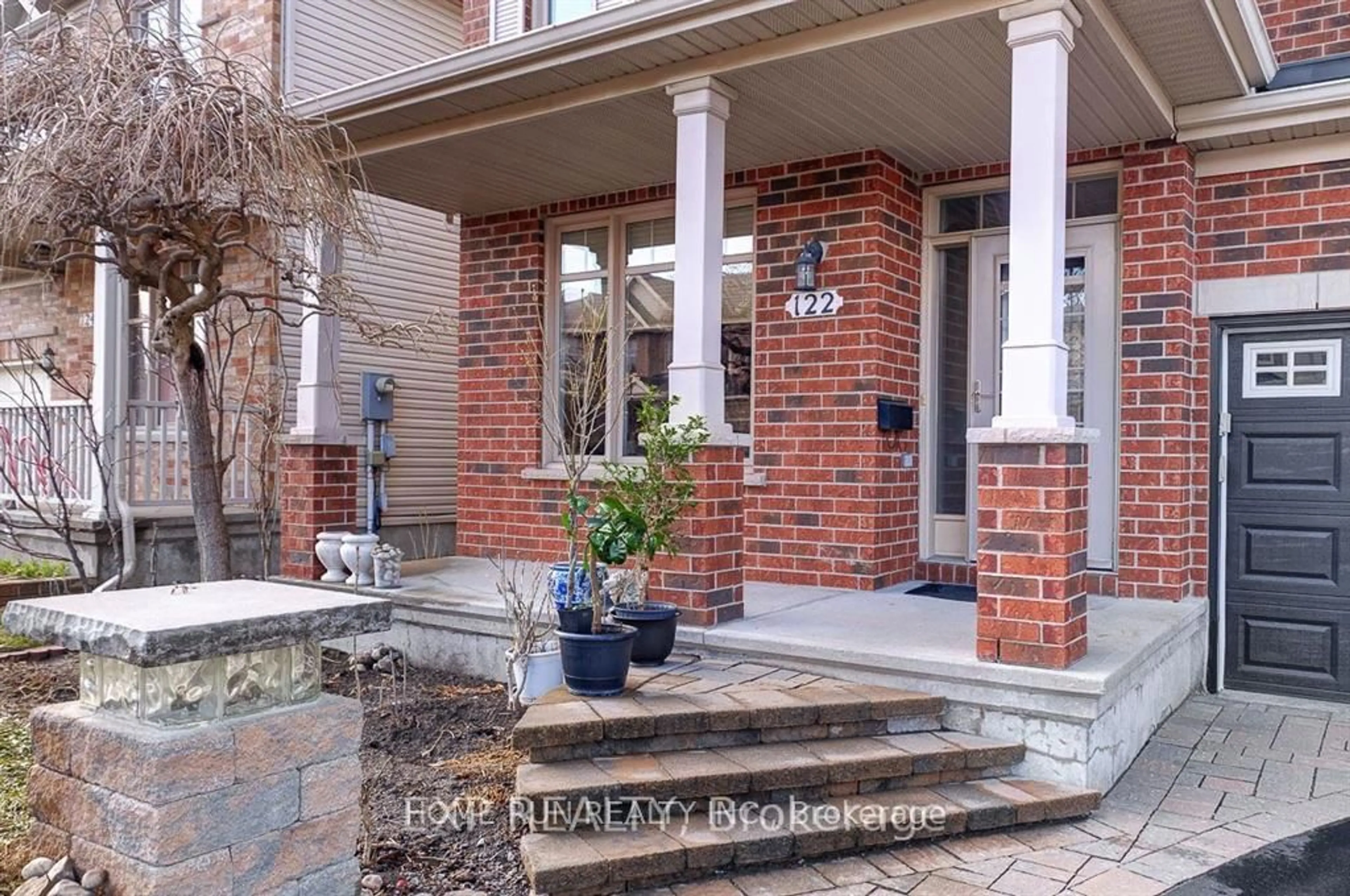 Home with brick exterior material, street for 122 Rodeo Dr, Barrhaven Ontario K2J 5K3