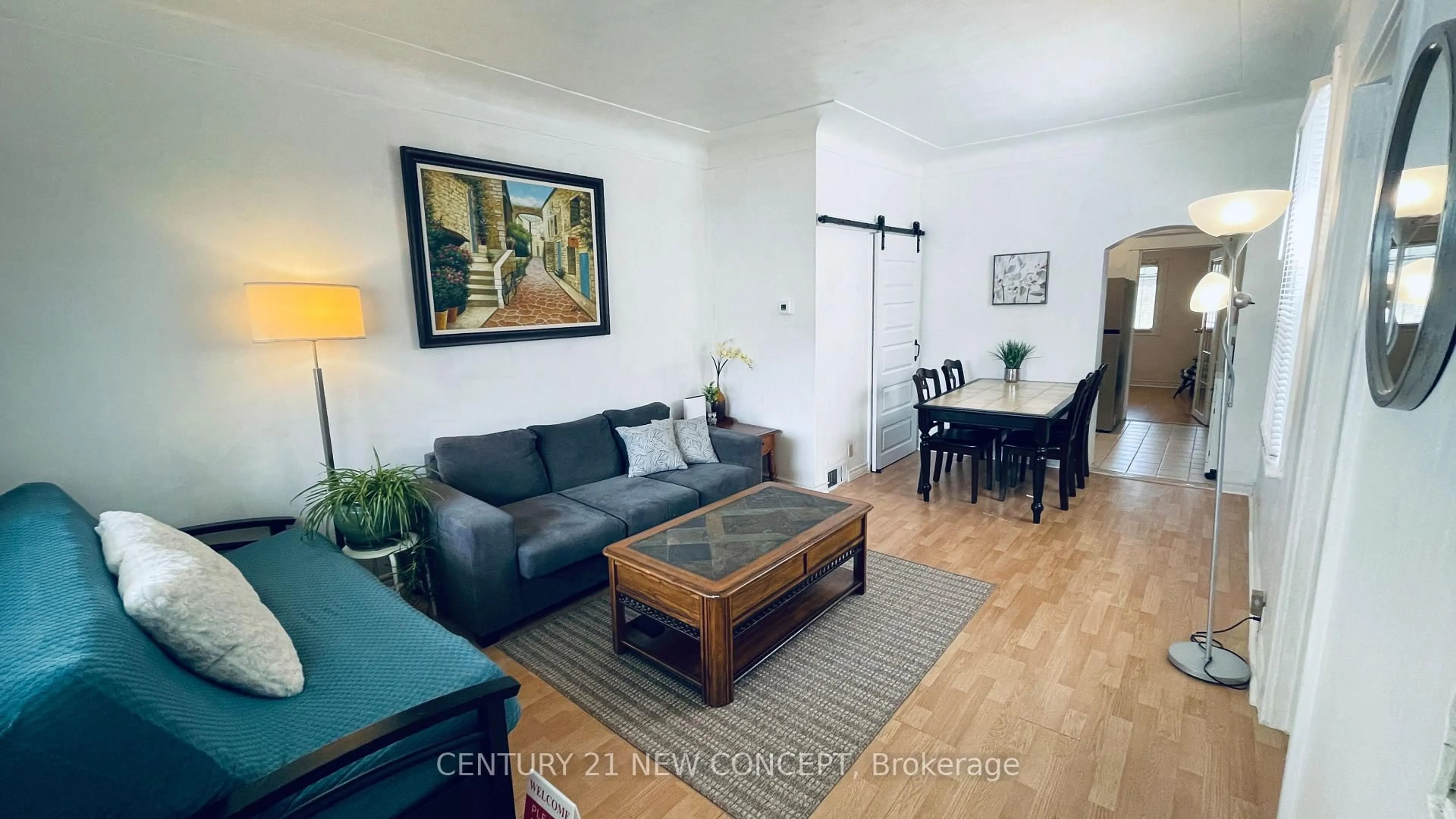 Living room with furniture, wood/laminate floor for 106 Emerald St, Hamilton Ontario L8L 5K4