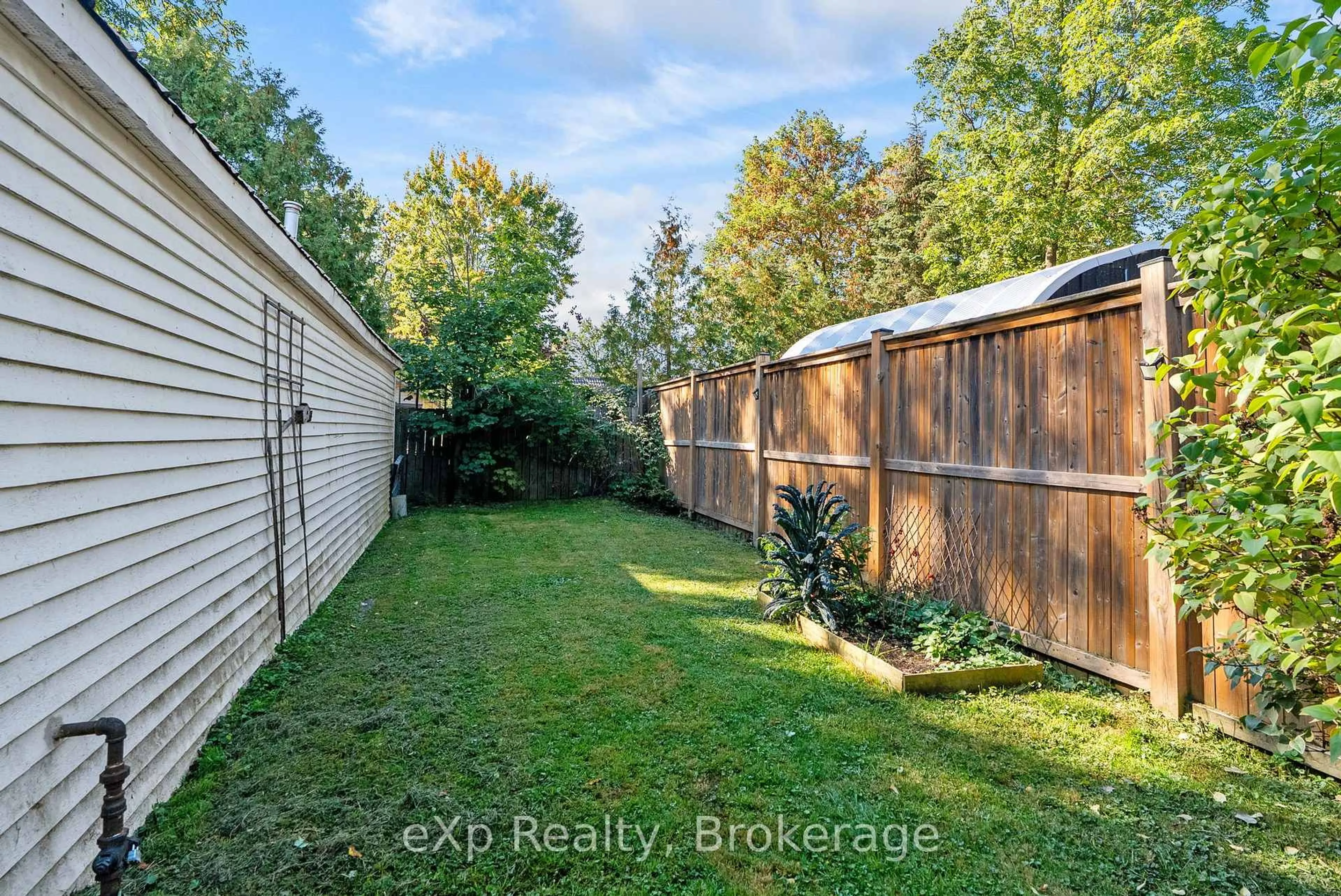 A pic from outside/outdoor area/front of a property/back of a property/a pic from drone, forest/trees view for 63 Guelph St, Stratford Ontario N5A 3W7