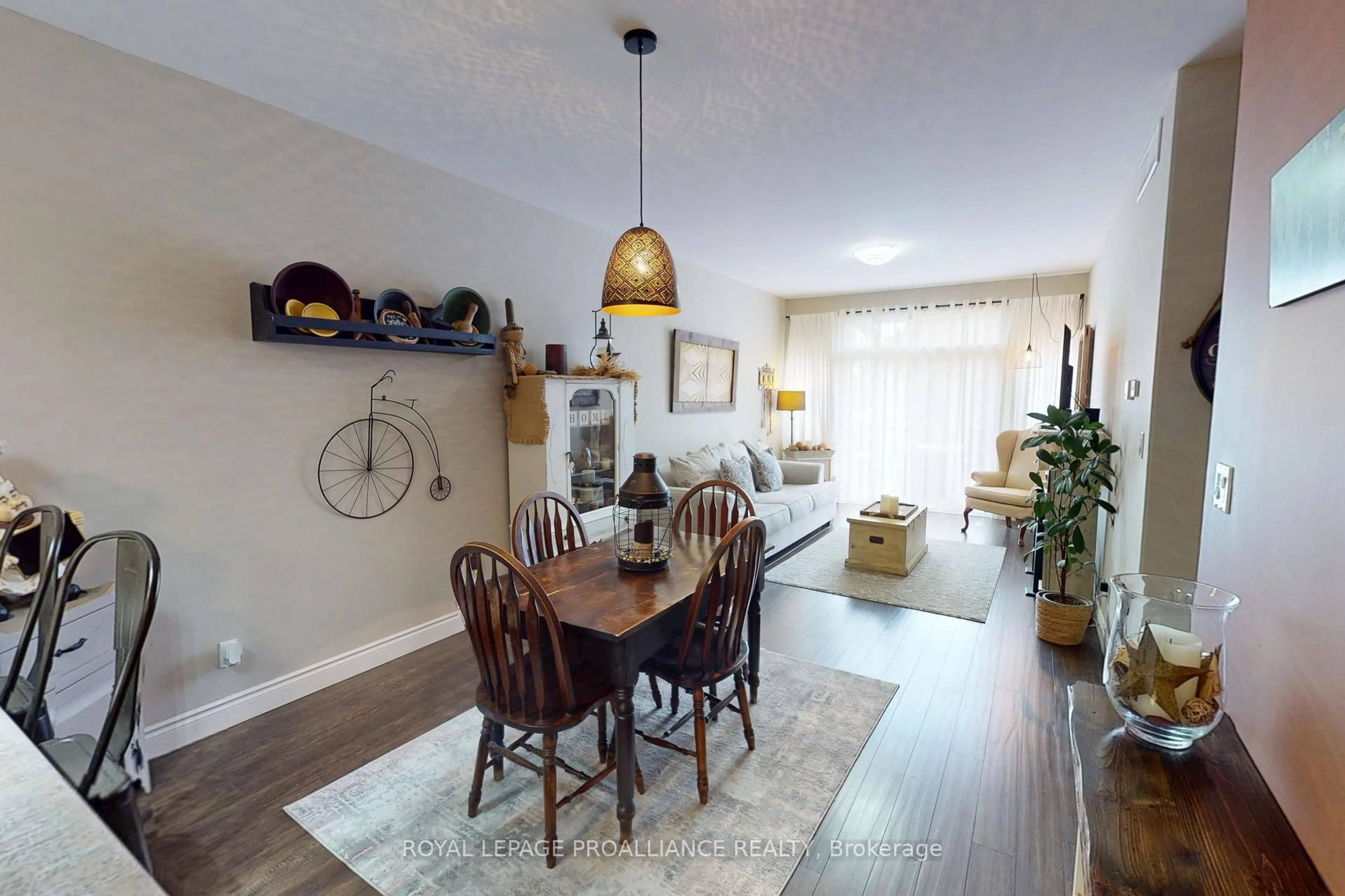 Living room with furniture, wood/laminate floor for 23 Ledgerock Crt, Quinte West Ontario K8R 0A1