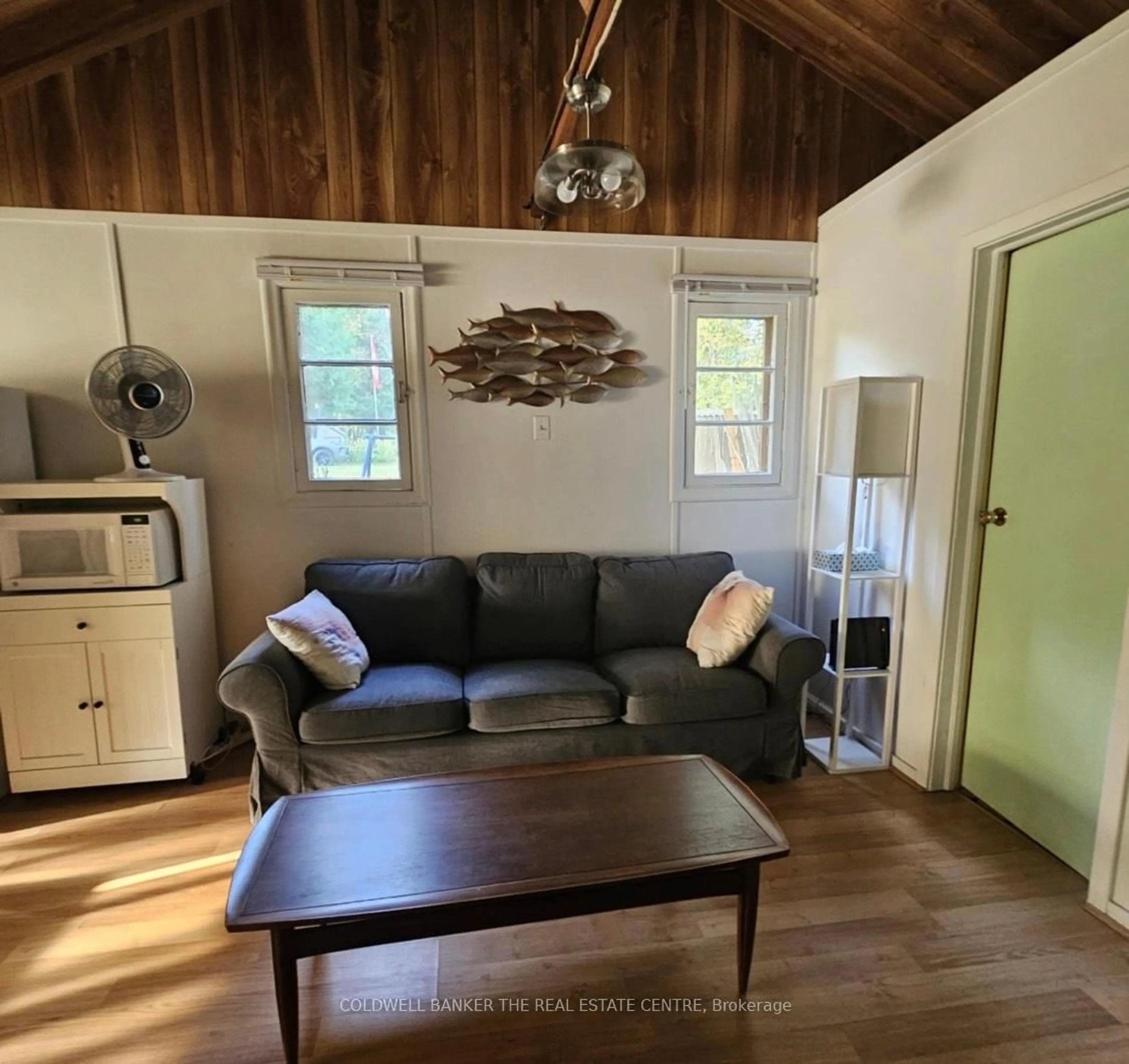 Living room with furniture, wood/laminate floor for 227 Sunset Beach Rd, Kawartha Lakes Ontario K0M 2B0