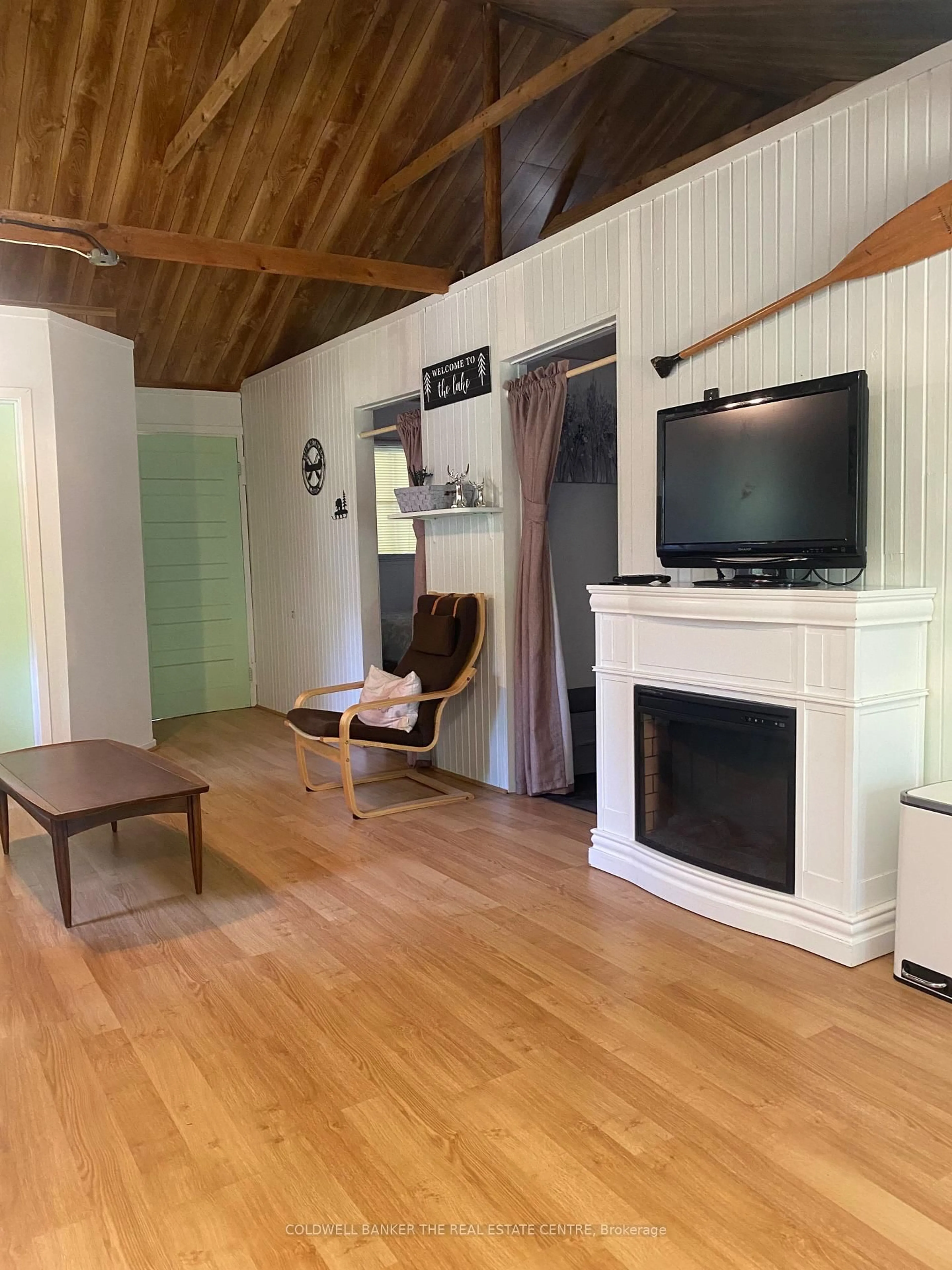 Living room with furniture, wood/laminate floor for 227 Sunset Beach Rd, Kawartha Lakes Ontario K0M 2B0