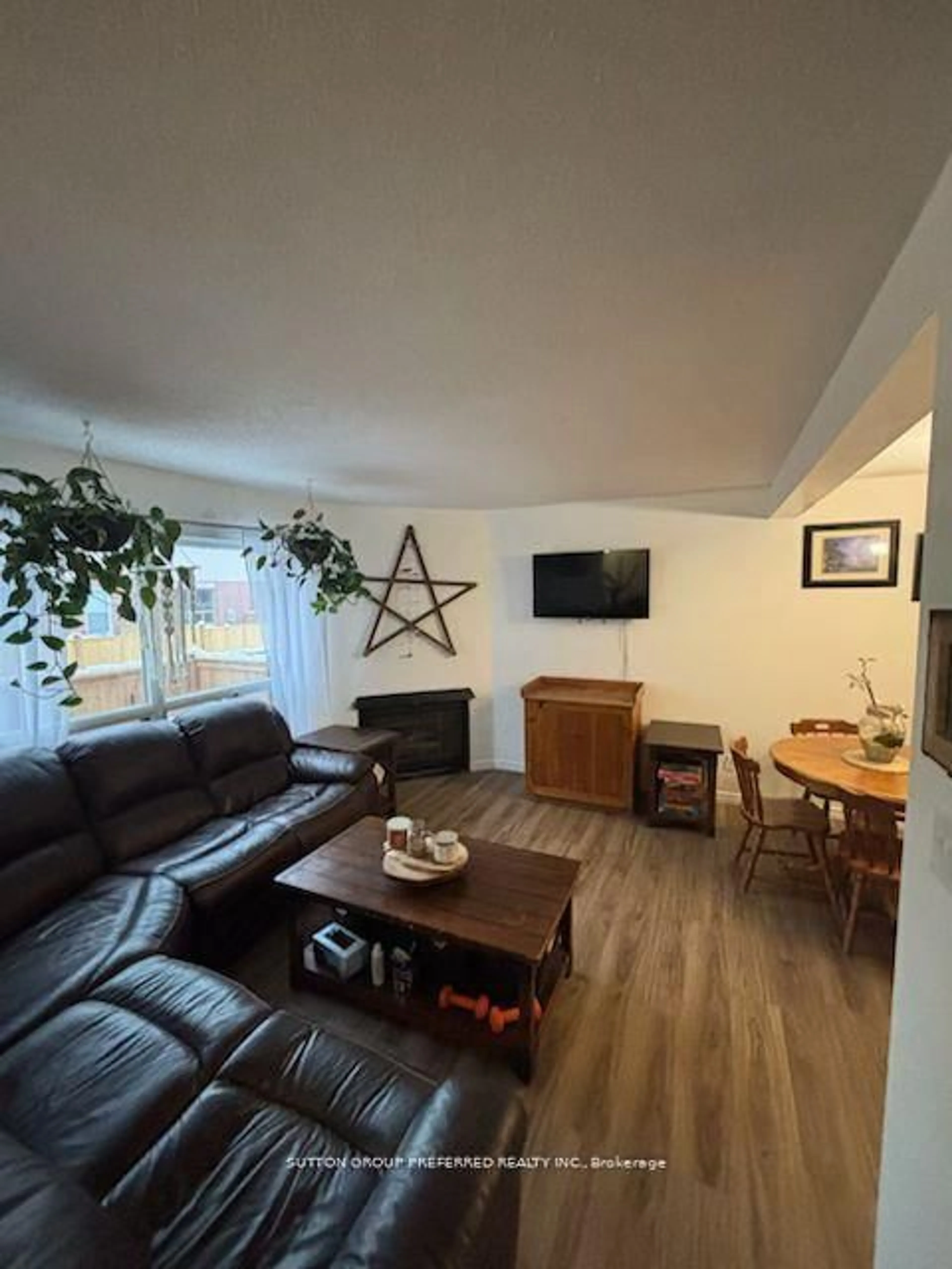 Living room with furniture, wood/laminate floor for 595 Third St #77, London East Ontario N5V 4A1