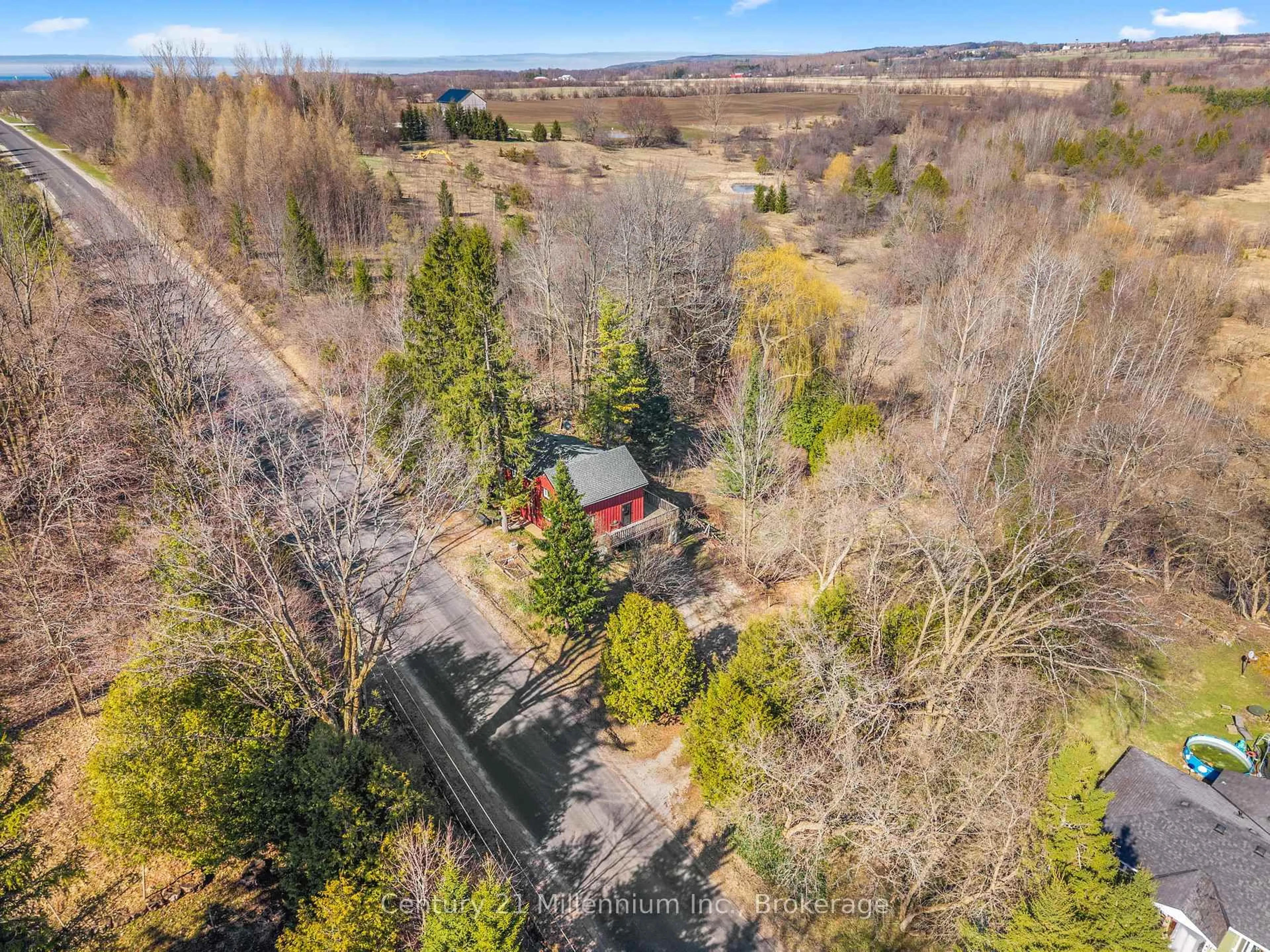 A pic from outside/outdoor area/front of a property/back of a property/a pic from drone, forest/trees view for 415877 Tenth Line, Blue Mountains Ontario N0H 1J0