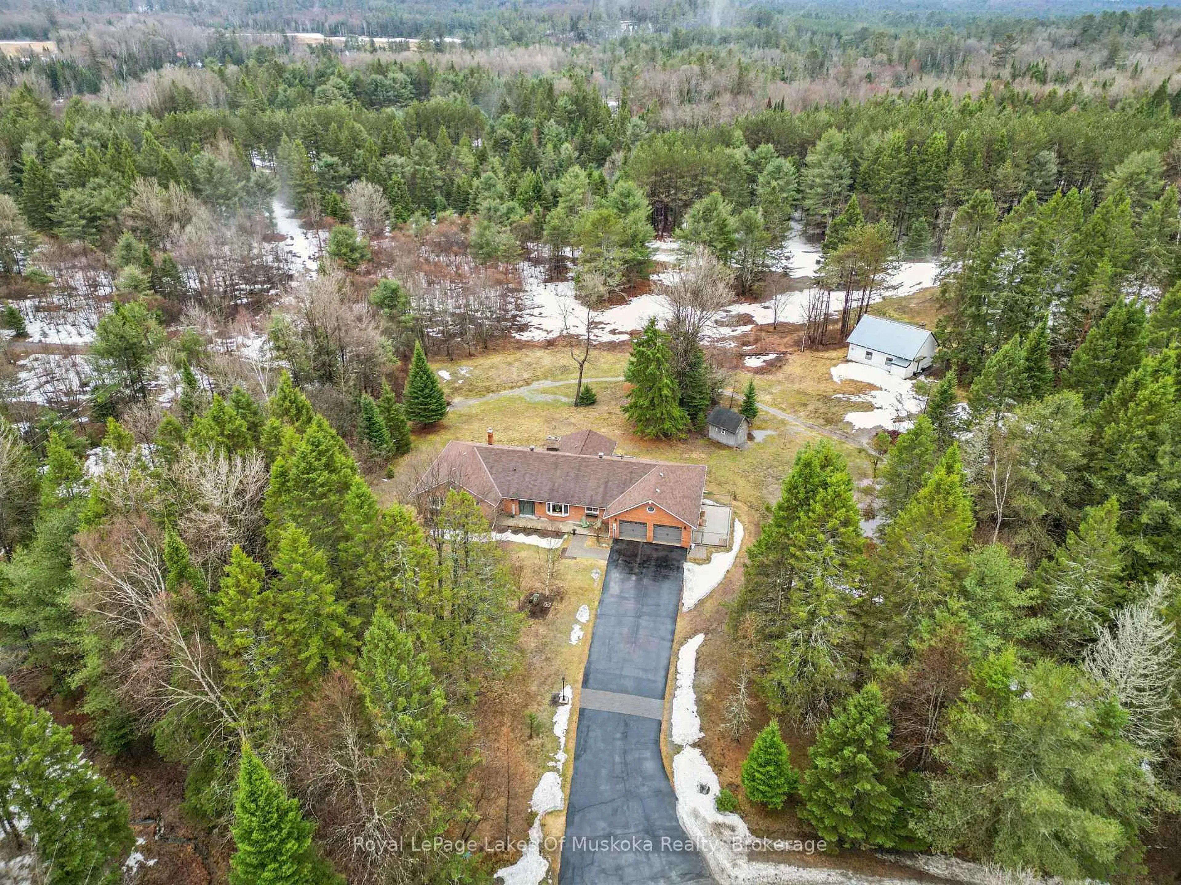 A pic from outside/outdoor area/front of a property/back of a property/a pic from drone, forest/trees view for 87 Laneige Ave, Huntsville Ontario P0B 1L0