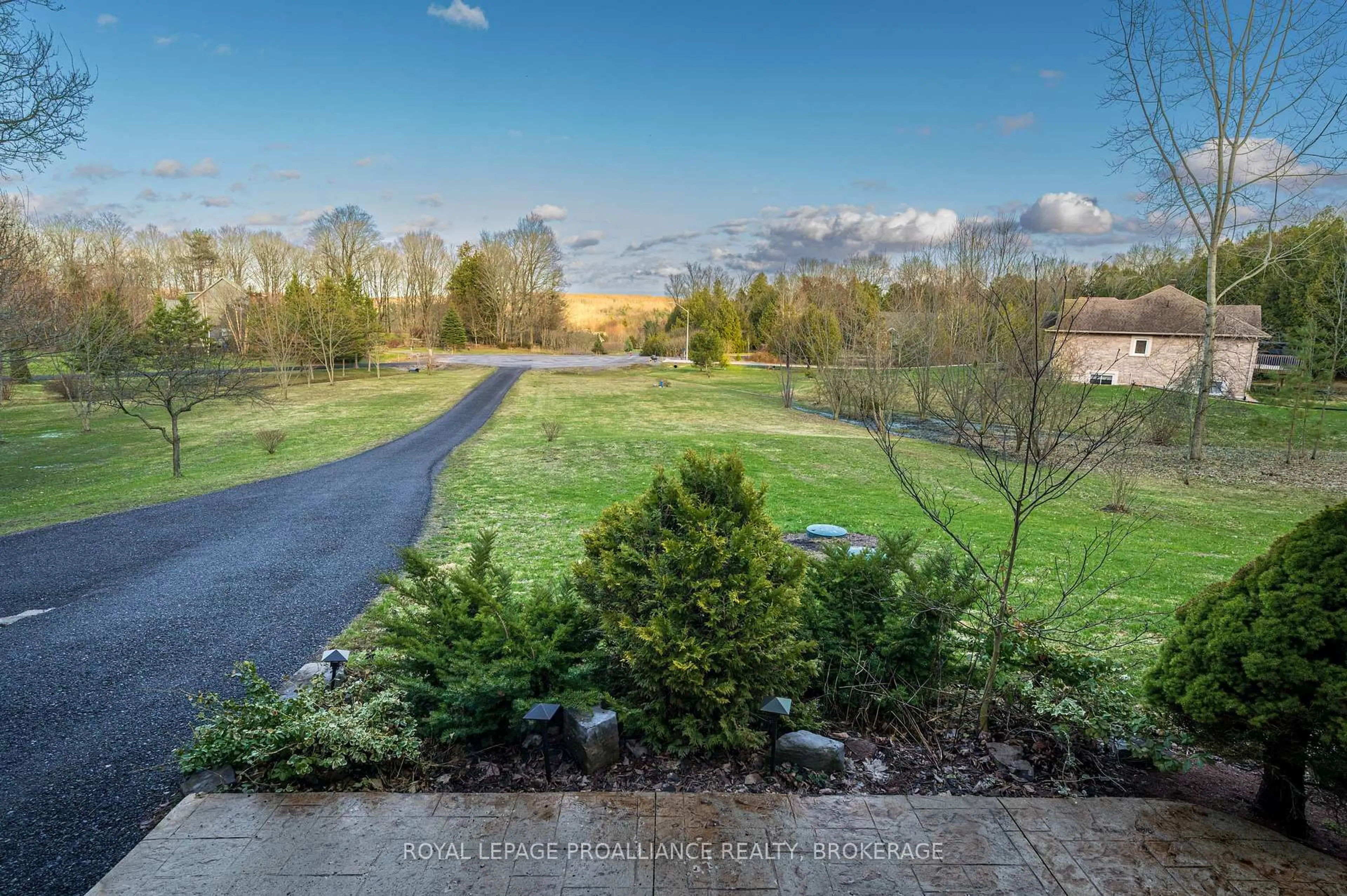 A pic from outside/outdoor area/front of a property/back of a property/a pic from drone, forest/trees view for 27 Collins Dr, Inverary Ontario K0H 1X0