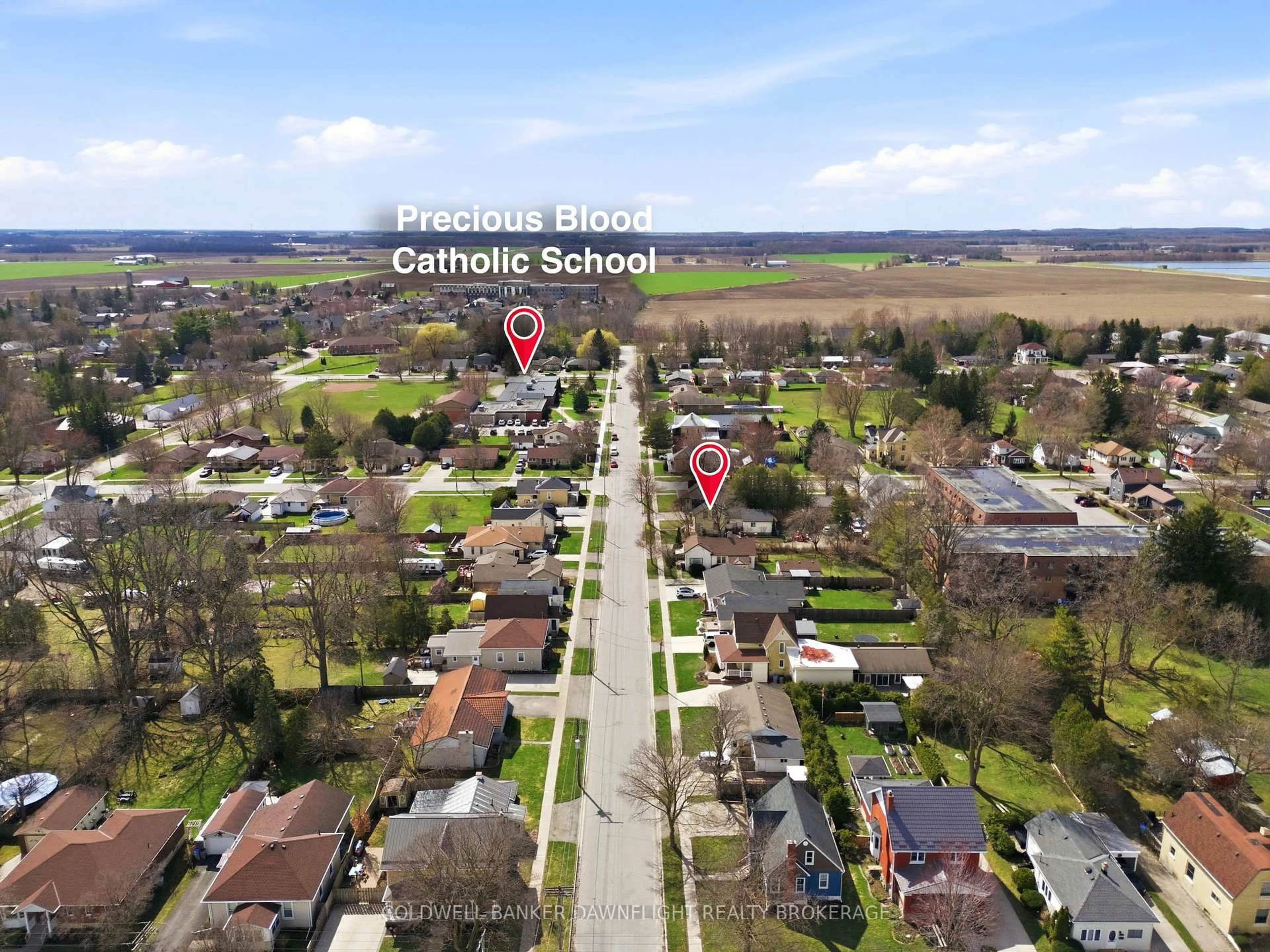 A pic from outside/outdoor area/front of a property/back of a property/a pic from drone, street for 80 Sanders St, South Huron Ontario N0M 1S2
