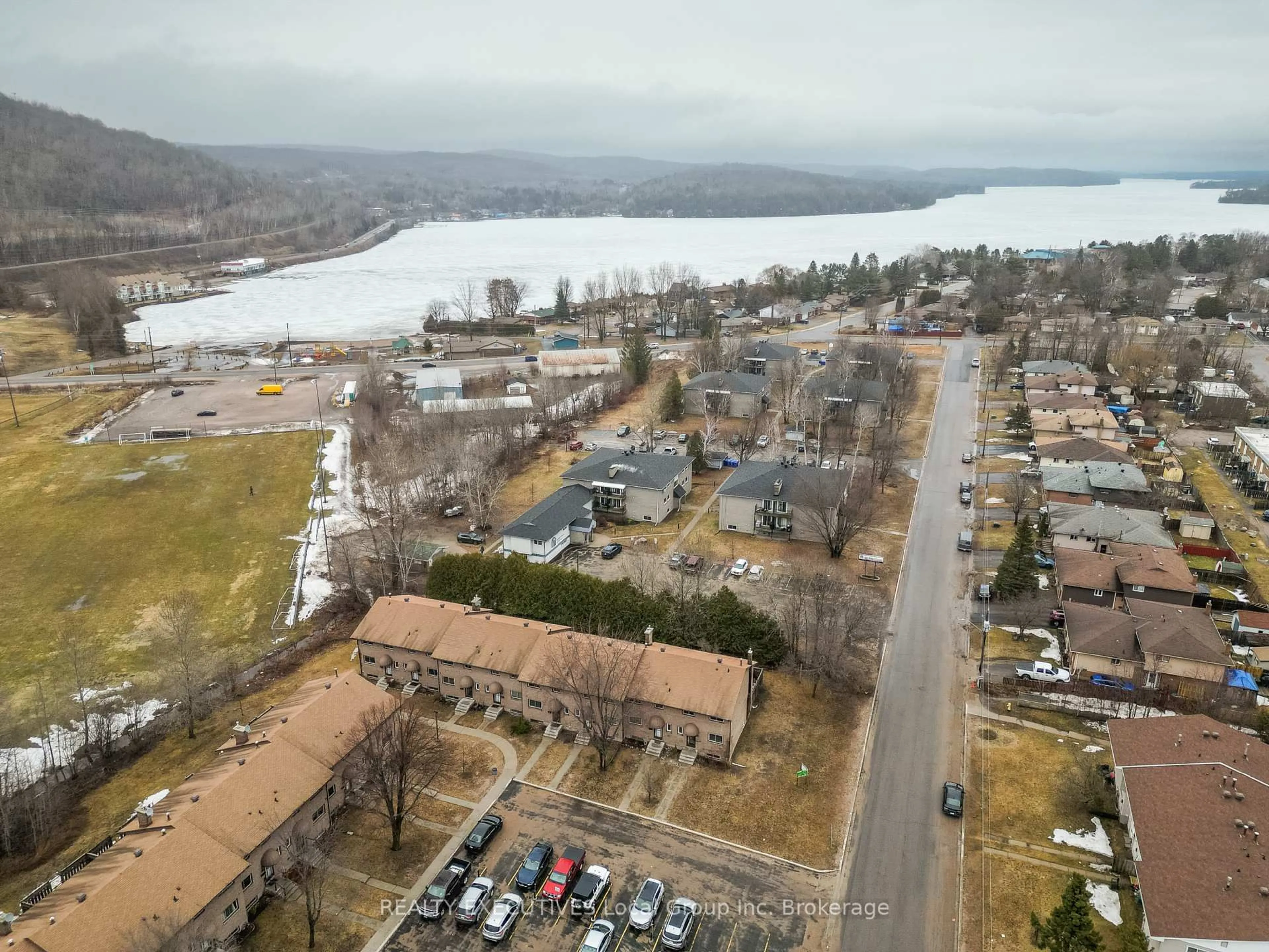 A pic from outside/outdoor area/front of a property/back of a property/a pic from drone, water/lake/river/ocean view for 398 Wickstead Ave #36, North Bay Ontario P1A 3L8