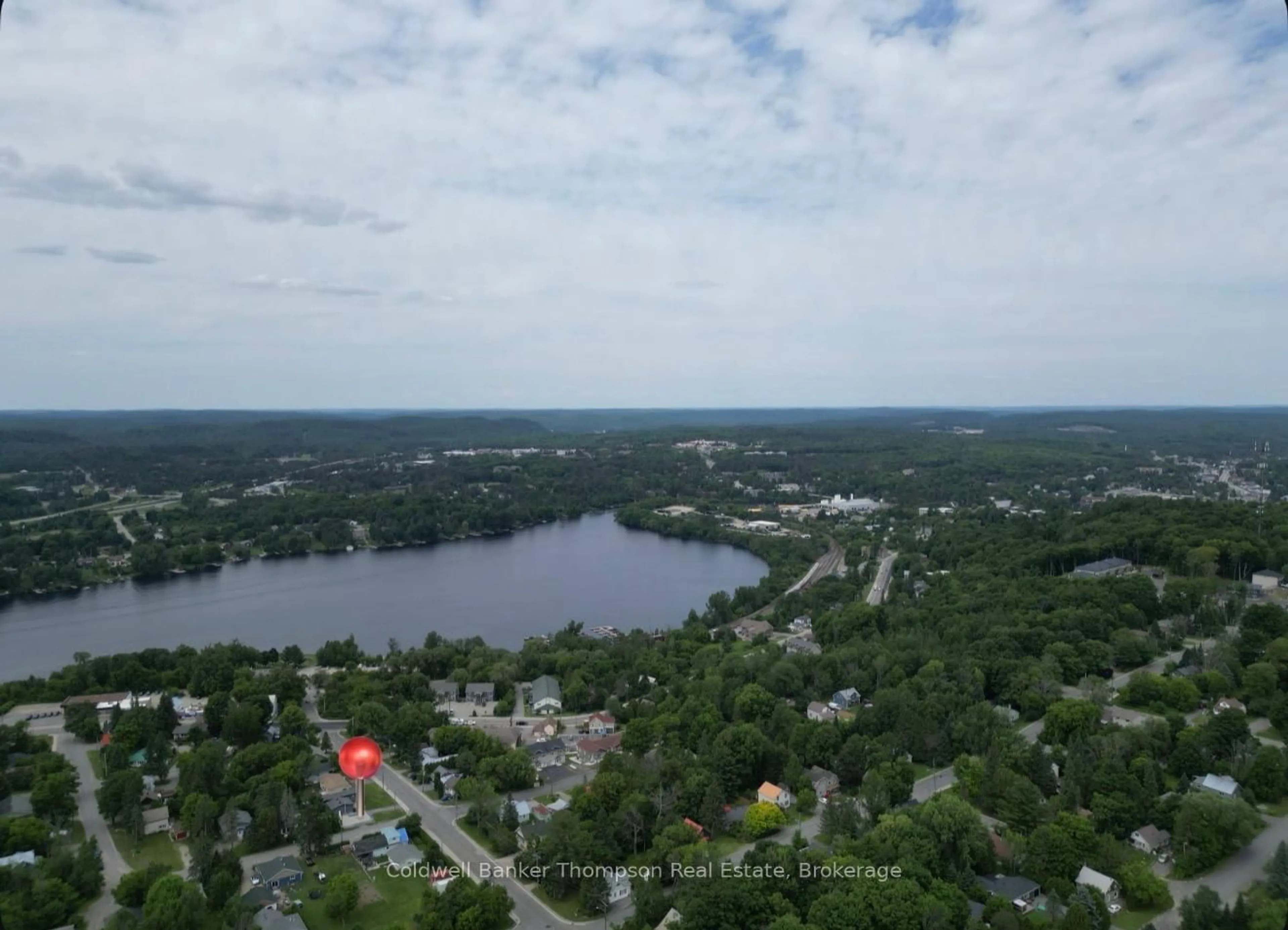 A pic from outside/outdoor area/front of a property/back of a property/a pic from drone, water/lake/river/ocean view for 13 Yonge St, Huntsville Ontario P1H 1W7