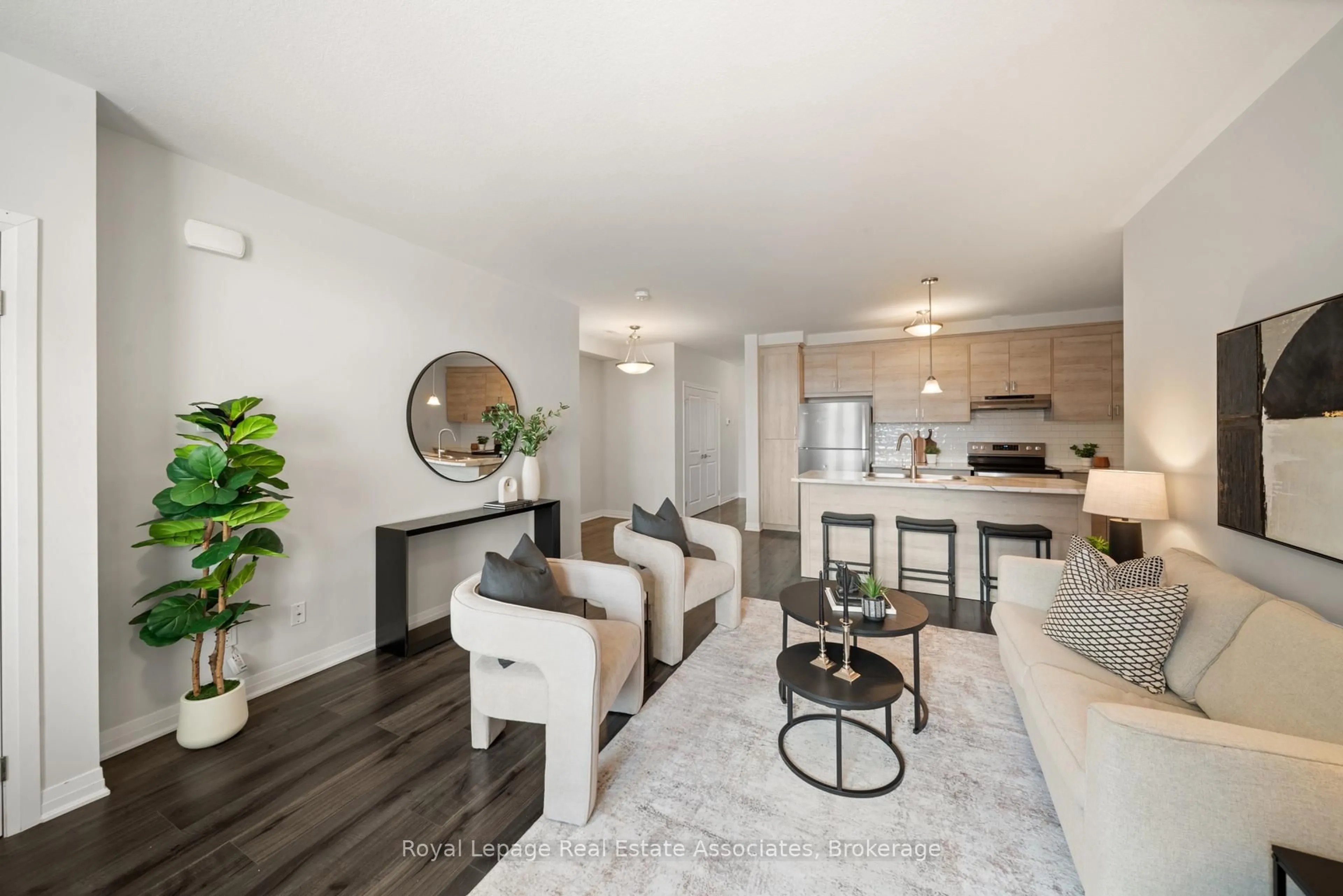 Living room with furniture, wood/laminate floor for 155 Thomas Slee Dr #2G, Kitchener Ontario N2P 2X5