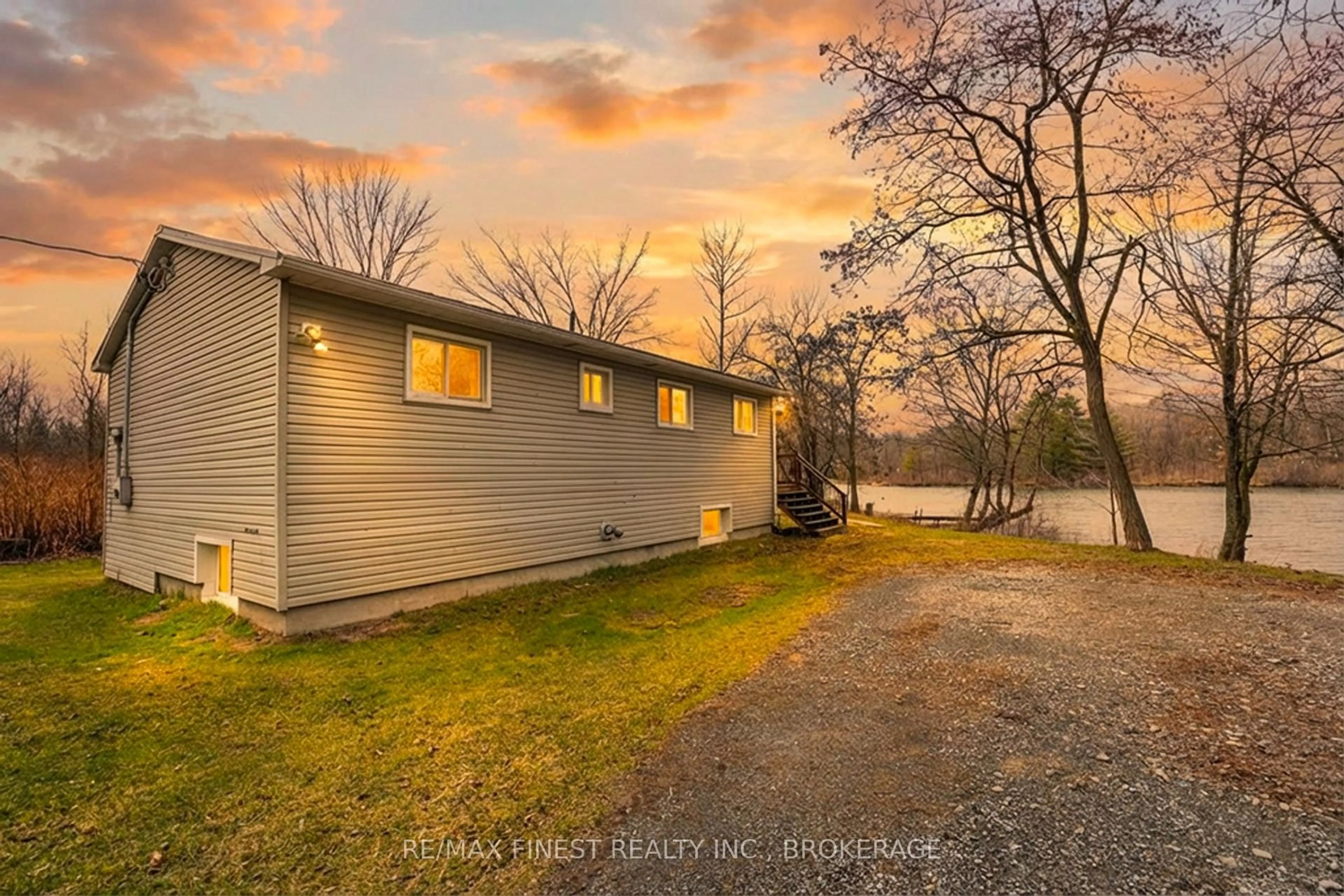 A pic from outside/outdoor area/front of a property/back of a property/a pic from drone, water/lake/river/ocean view for 4419 Westview Lane, Battersea Ontario K0H 1H0