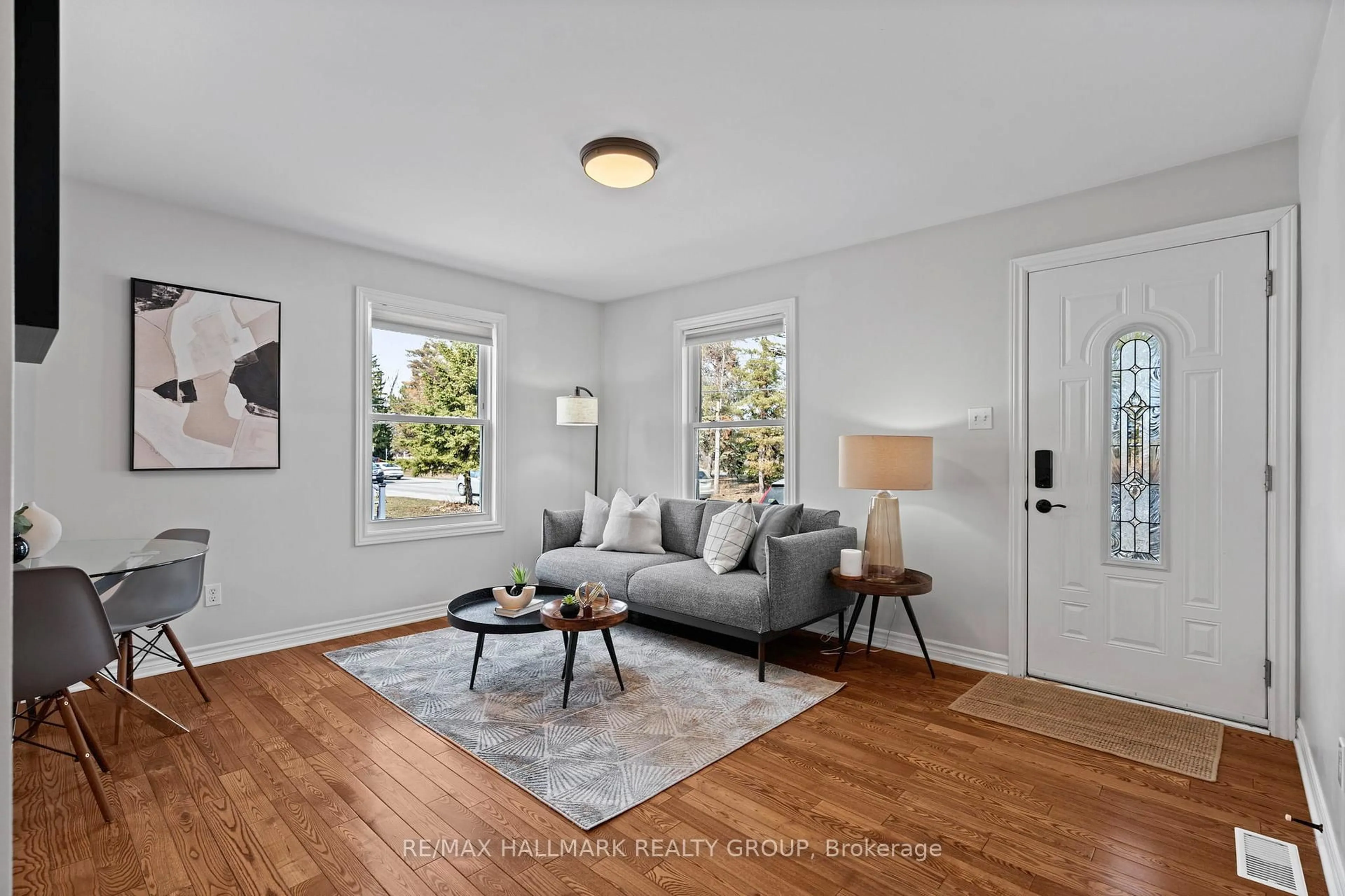 Living room with furniture, wood/laminate floor for 924 Fisher Ave, Ottawa Ontario K1Z 6P4