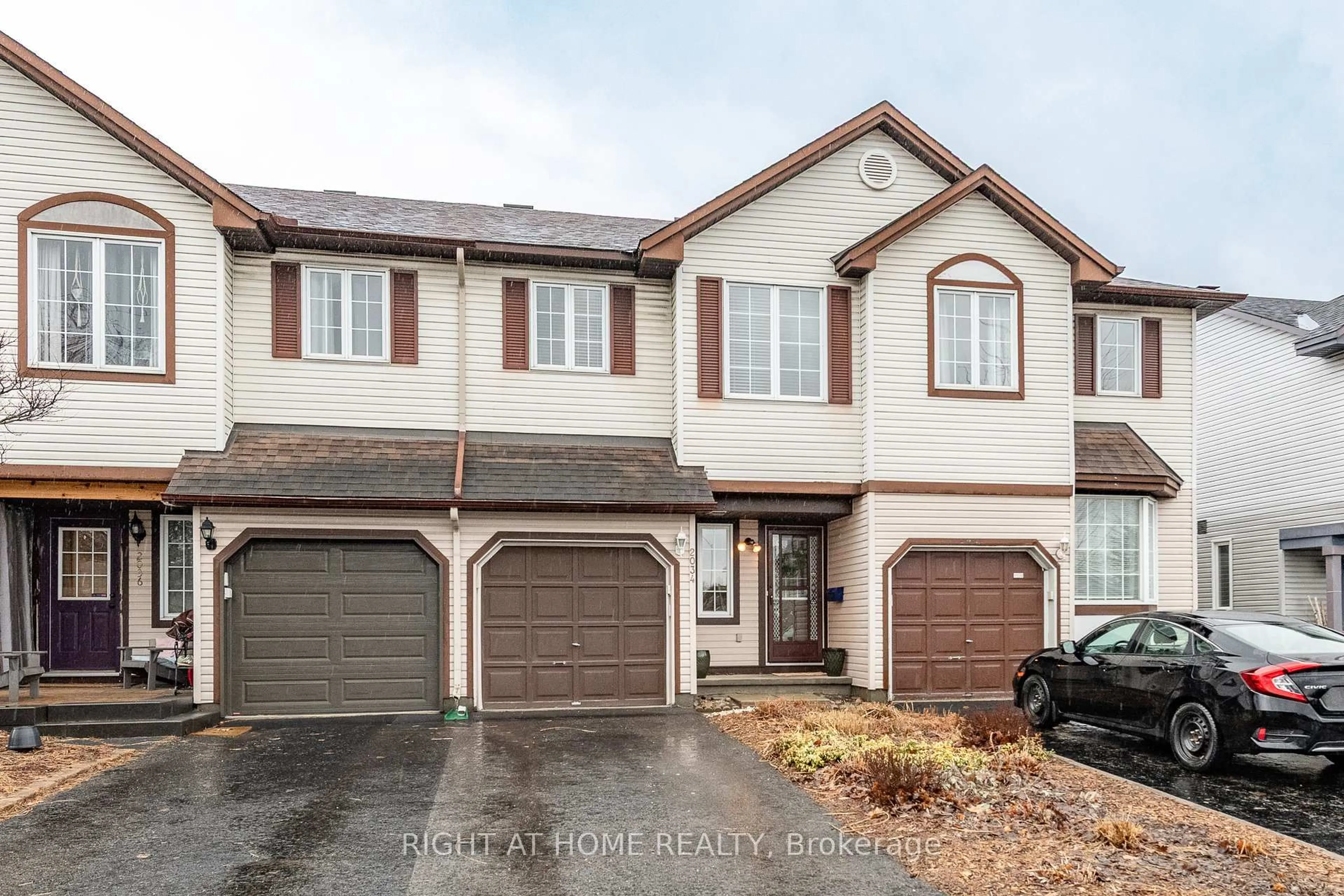 Home with vinyl exterior material, street for 2034 P Ave, Ottawa Ontario K1G 6G7