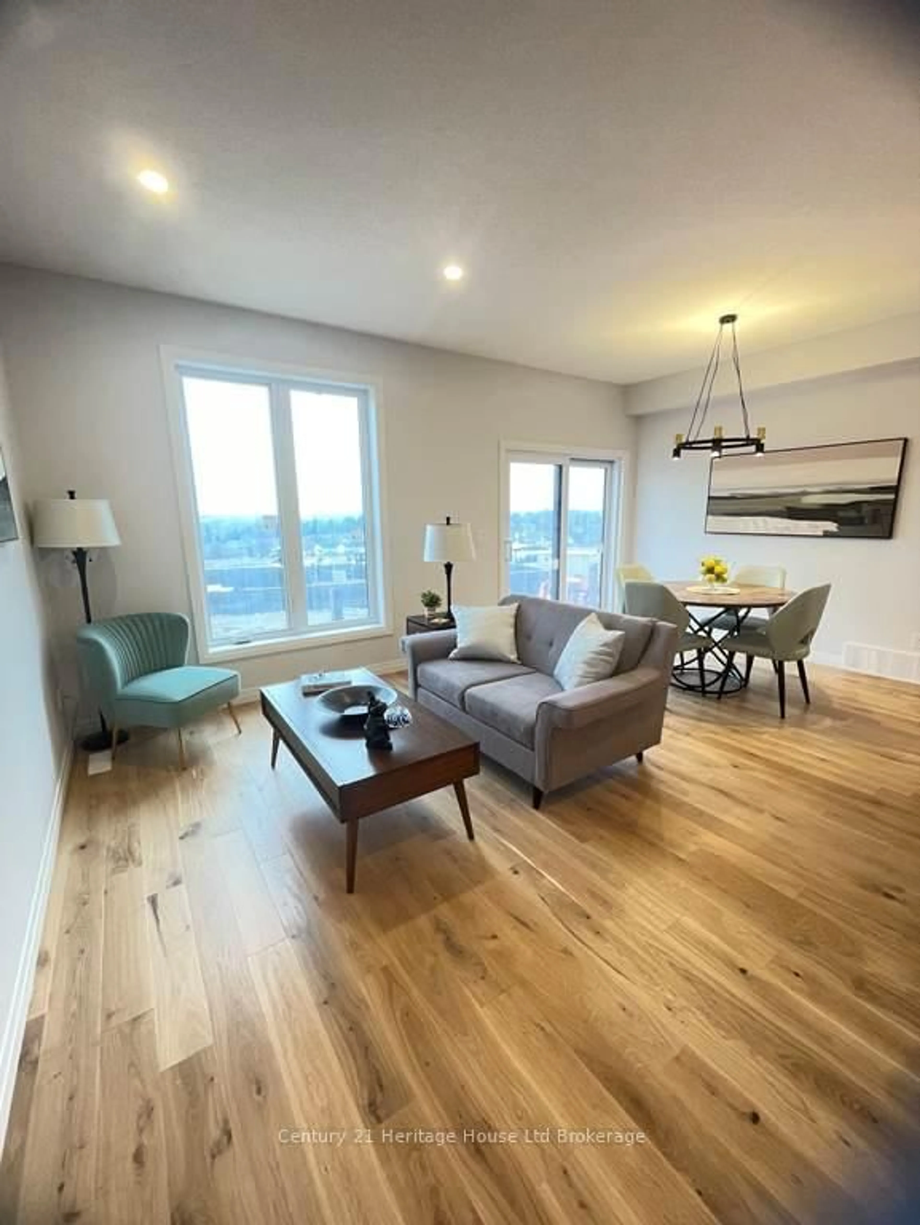 Living room with furniture, wood/laminate floor for 315 Kading Cres, Woodstock Ontario N4S 0G6