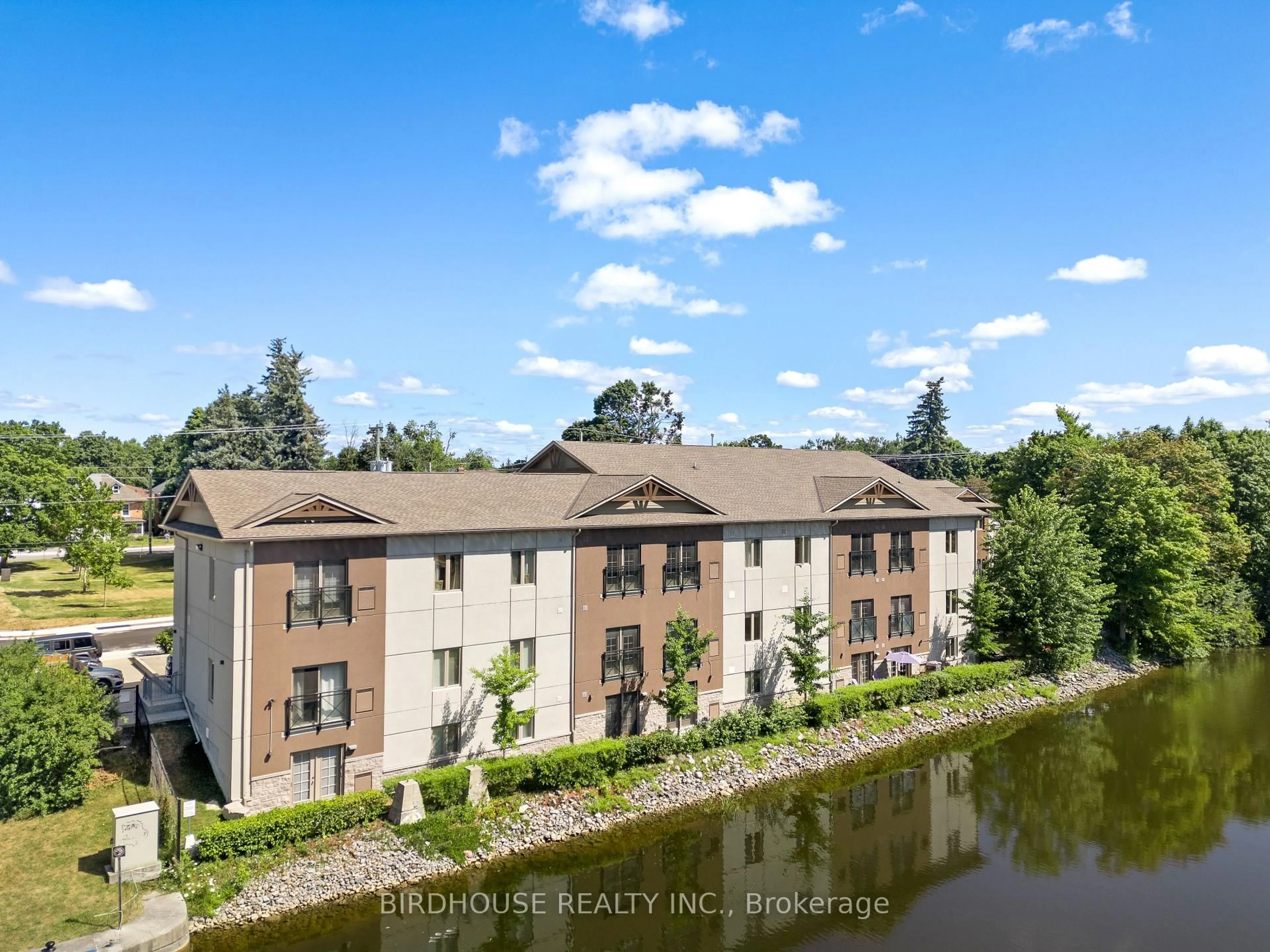 A pic from outside/outdoor area/front of a property/back of a property/a pic from drone, water/lake/river/ocean view for 25 King St #301, Kawartha Lakes Ontario K9V 1C4