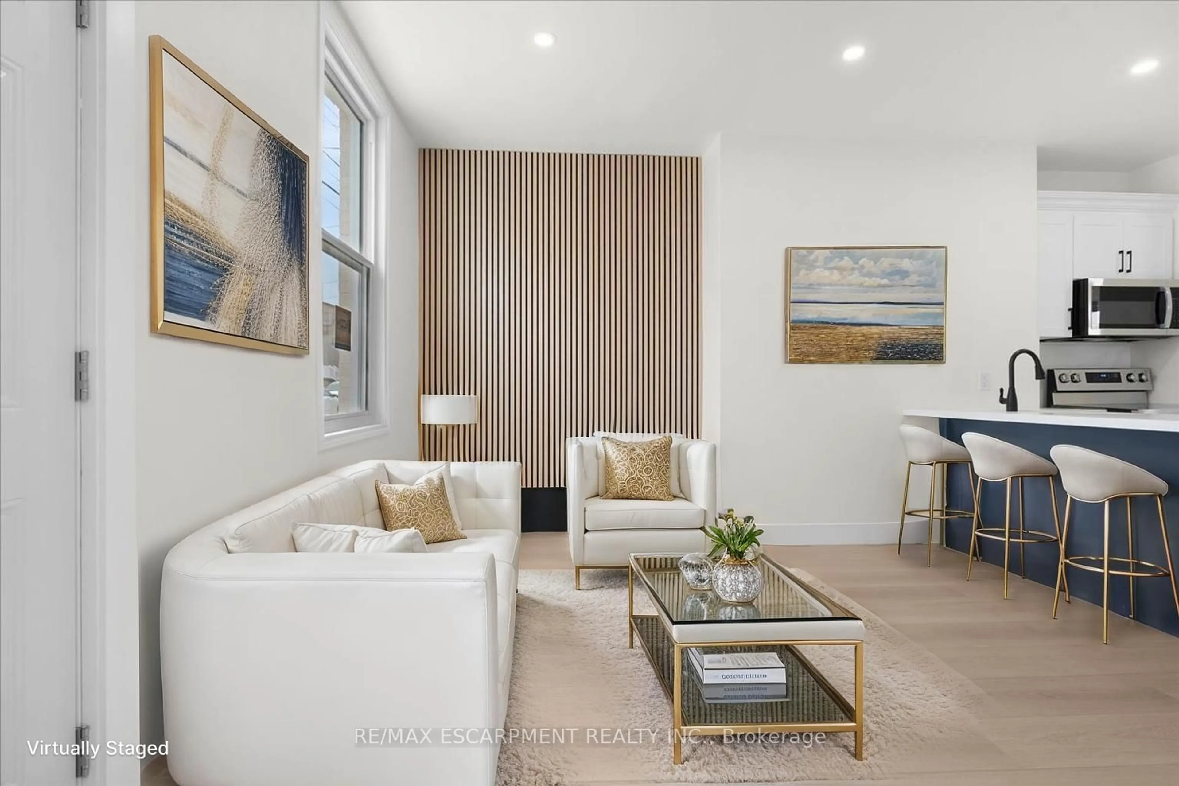 Living room with furniture, wood/laminate floor for 215 Ray St, Hamilton Ontario L8R 2Y3