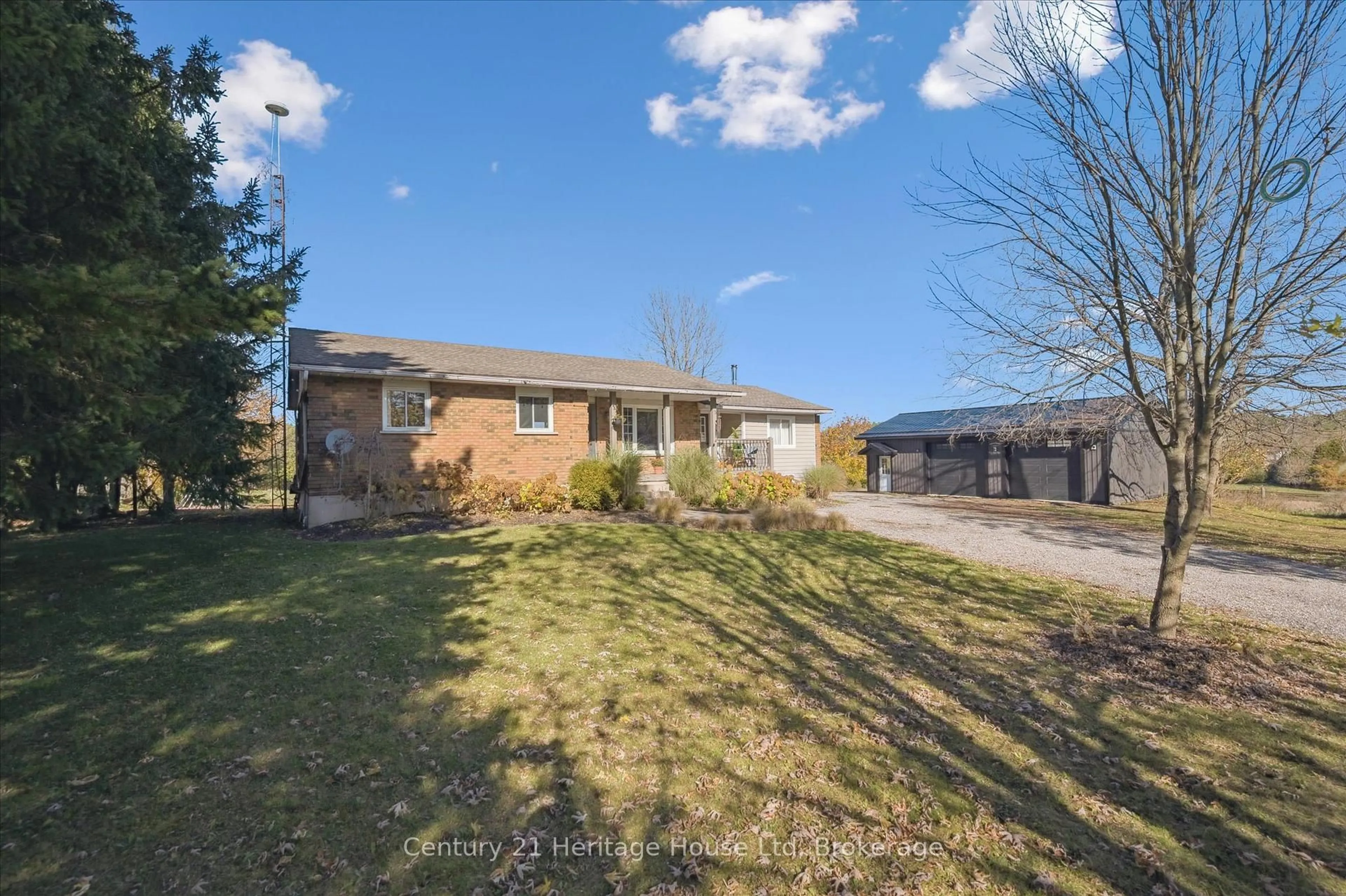 A pic from outside/outdoor area/front of a property/back of a property/a pic from drone, street for 323135 Durham Rd, West Grey Ontario N0G 1R0