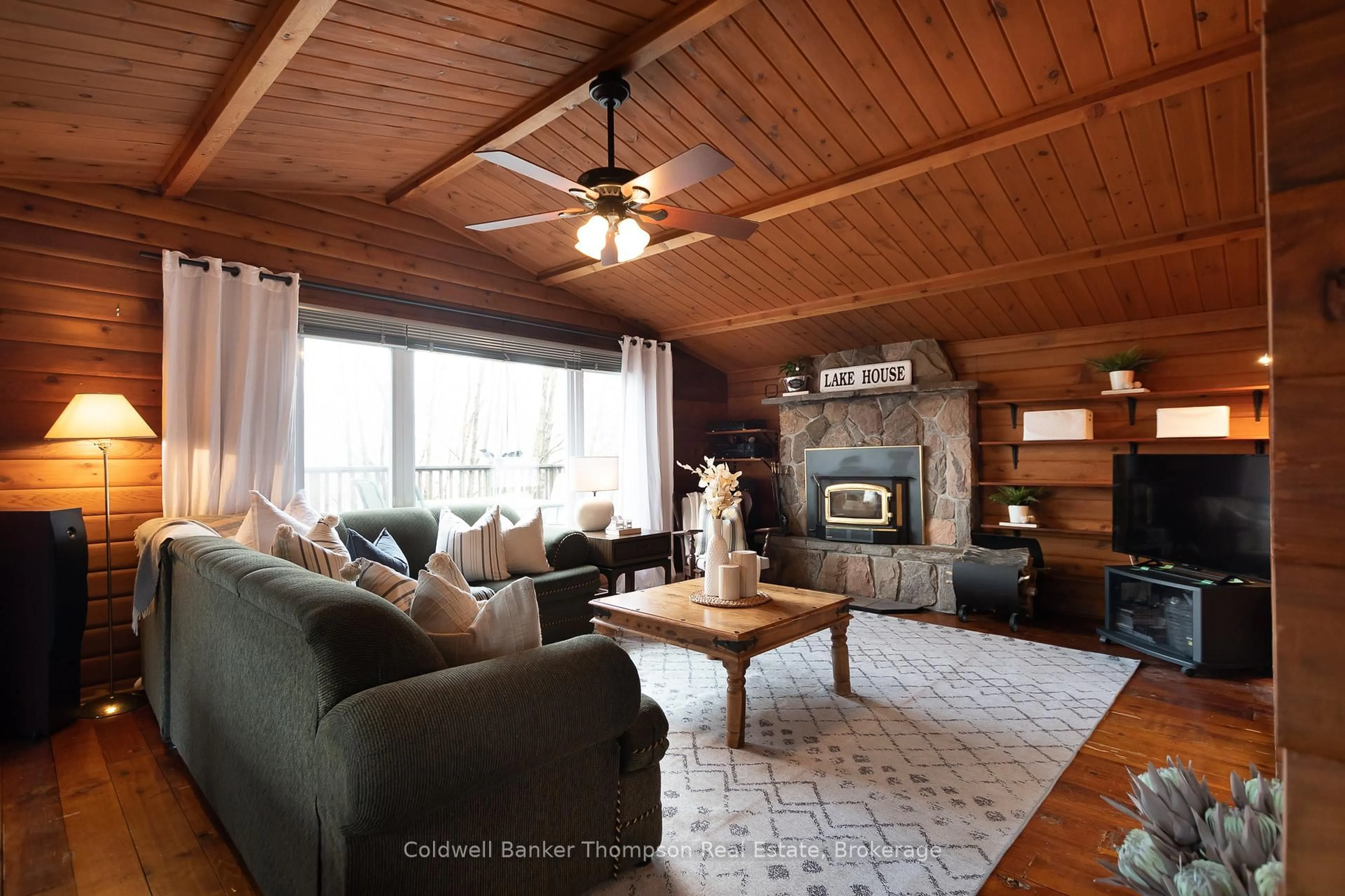 Living room with furniture, wood/laminate floor for 1802 Valley Rd, Huntsville Ontario P1H 1A8