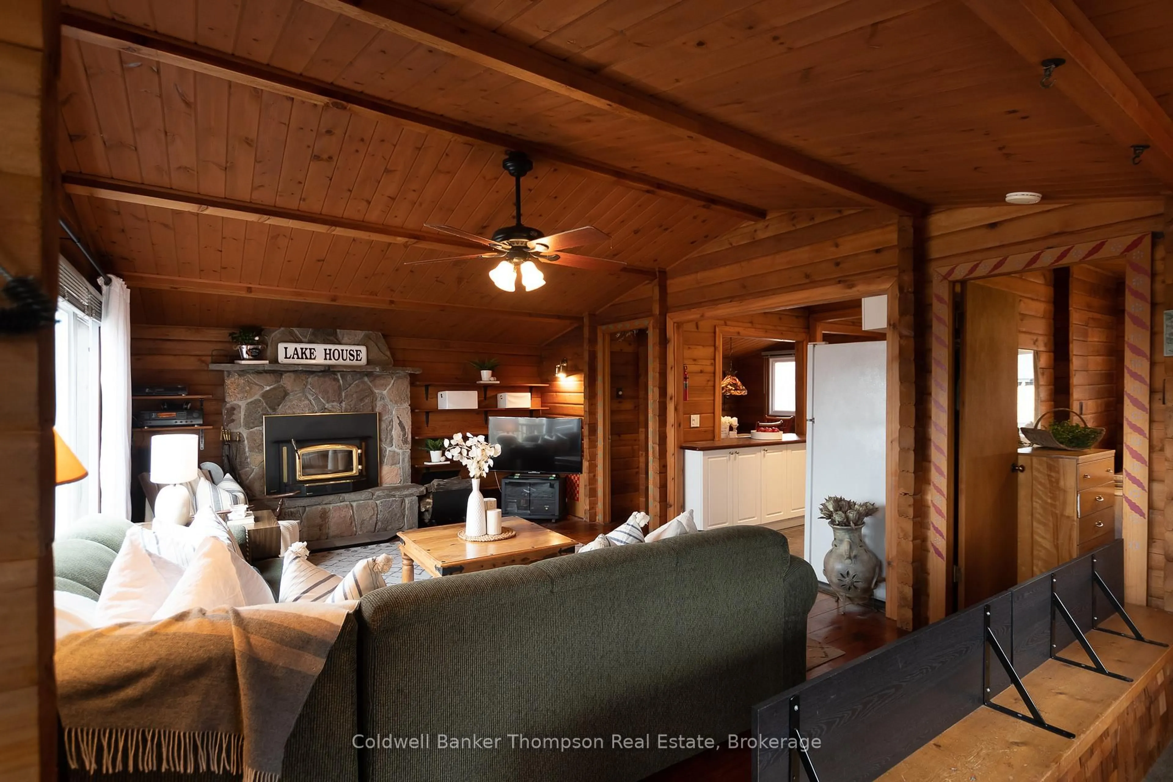 Living room with furniture, wood/laminate floor for 1802 Valley Rd, Huntsville Ontario P1H 1A8