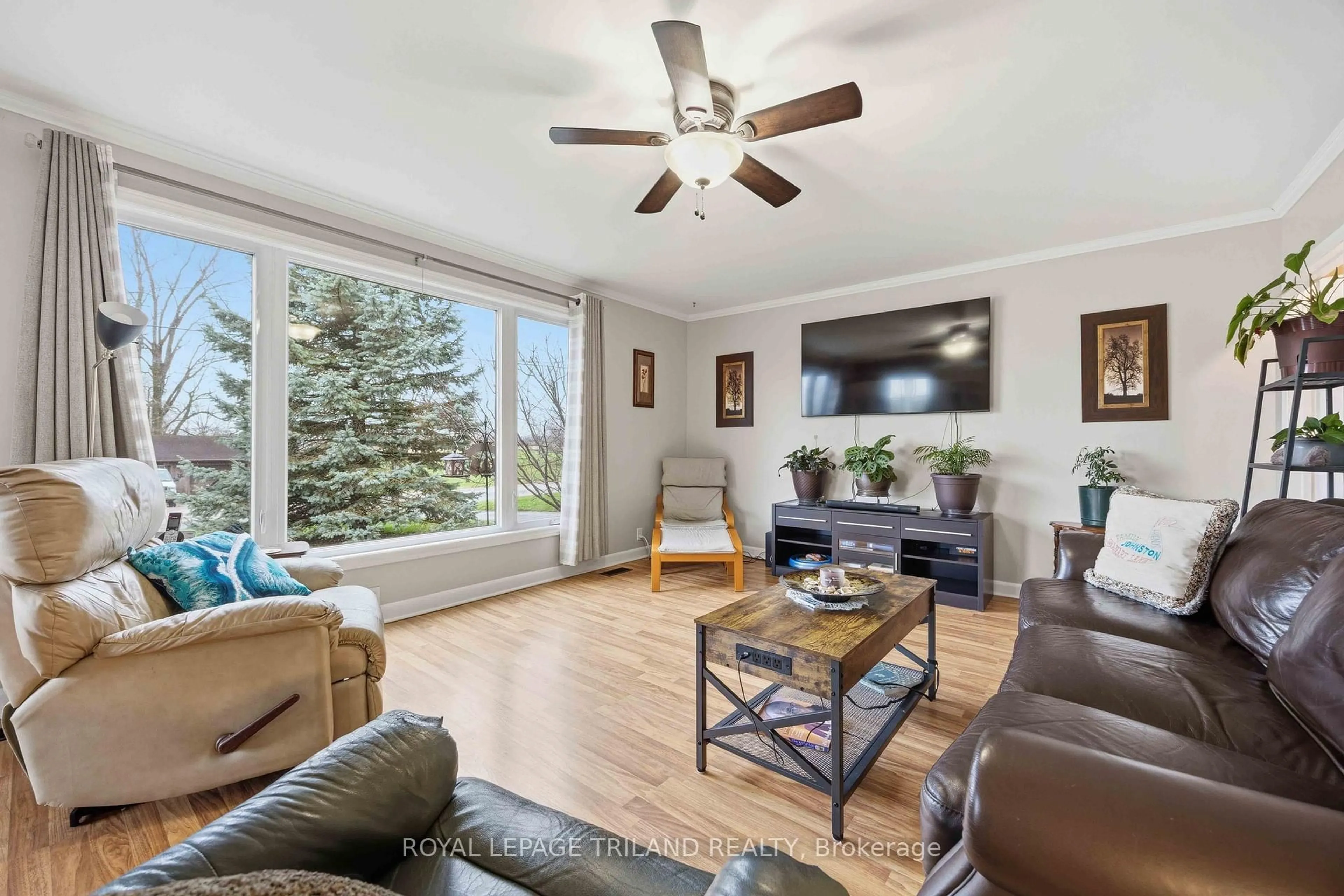 Living room with furniture, wood/laminate floor for 8376 Townsend Line, Lambton Shores Ontario N0M 1B0