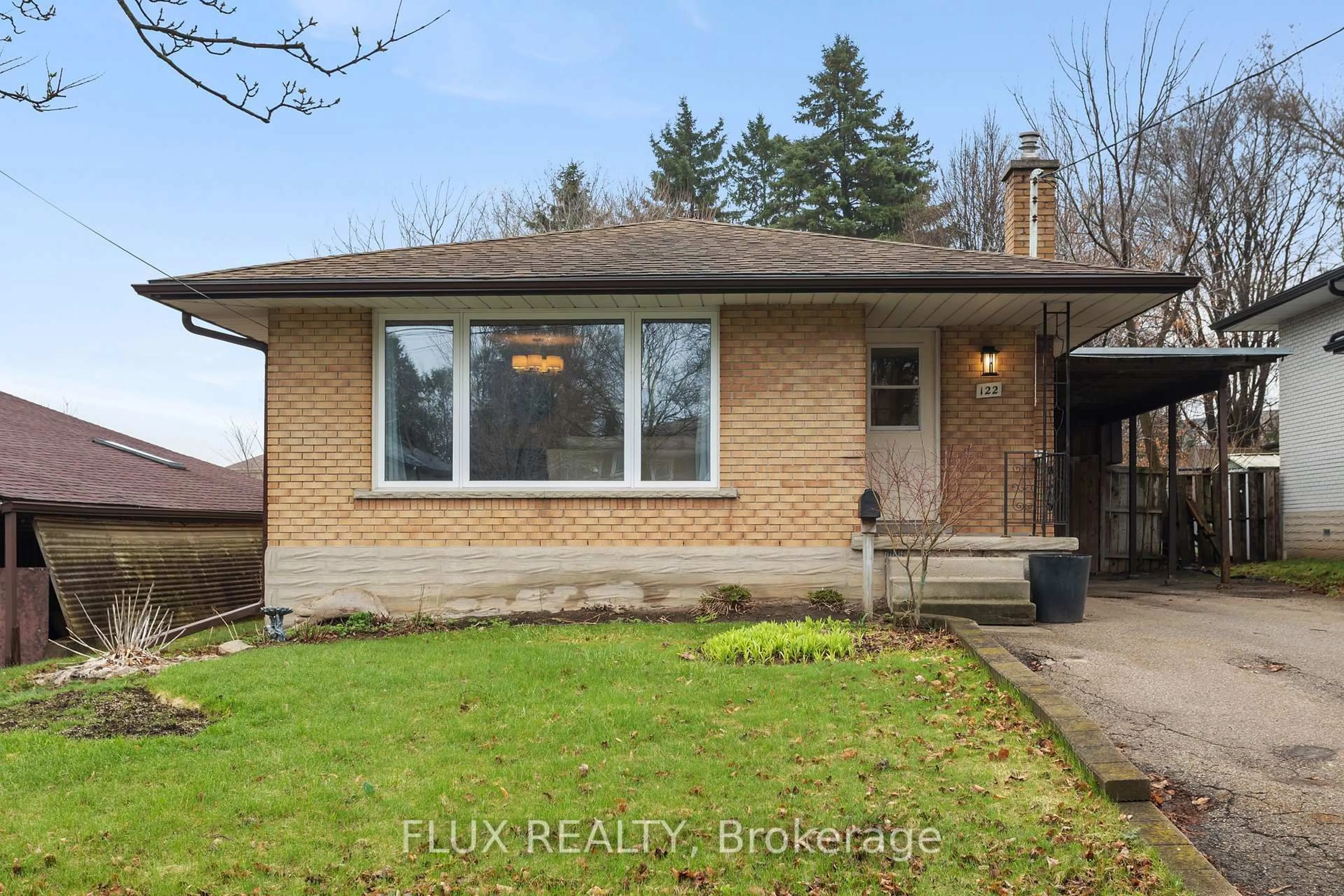 Home with brick exterior material, street for 122 Sweetbriar Dr, Kitchener Ontario N2M 4S6
