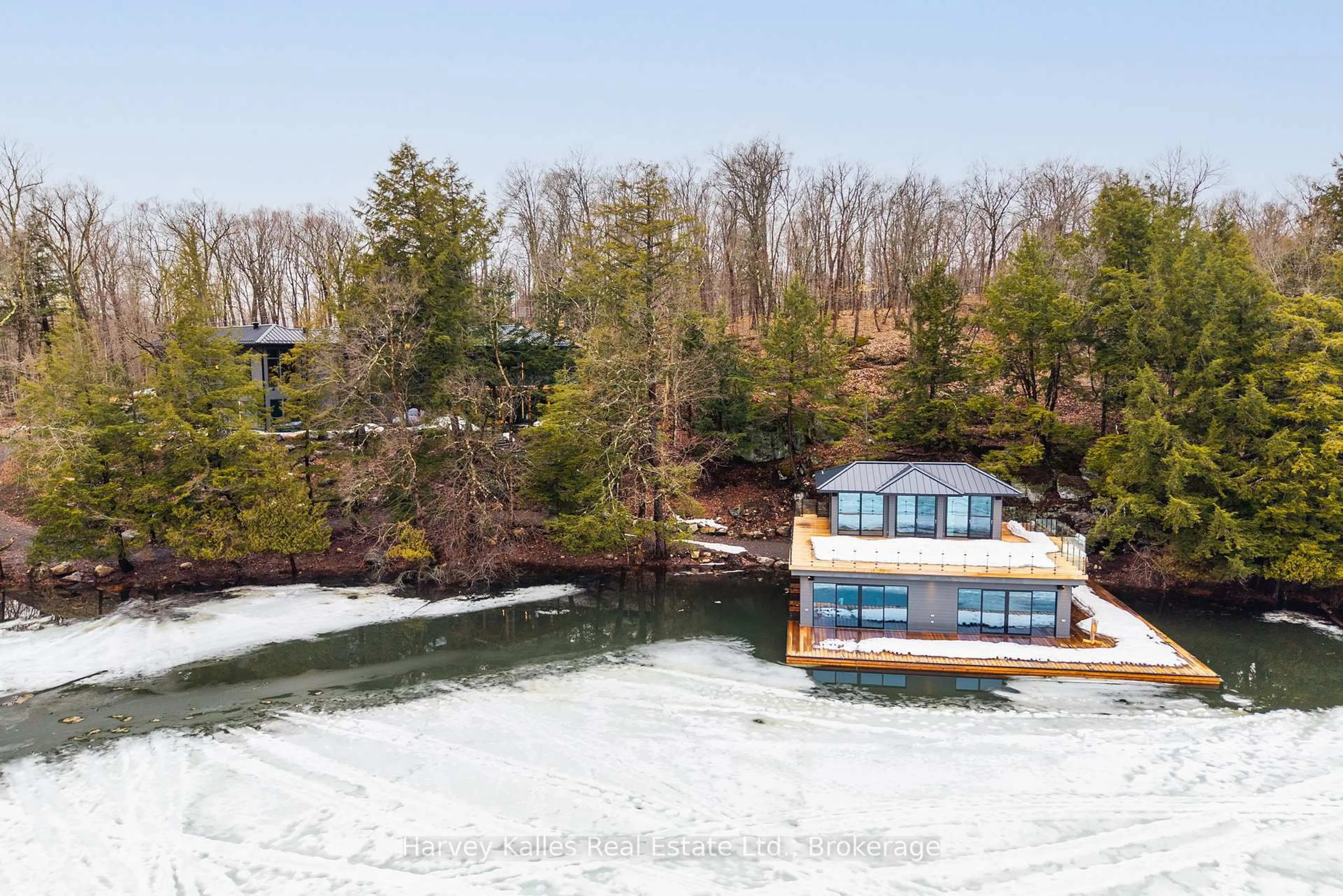 A pic from outside/outdoor area/front of a property/back of a property/a pic from drone, water/lake/river/ocean view for 1013 Hall's Rd #2, Muskoka Lakes Ontario P0B 1J0