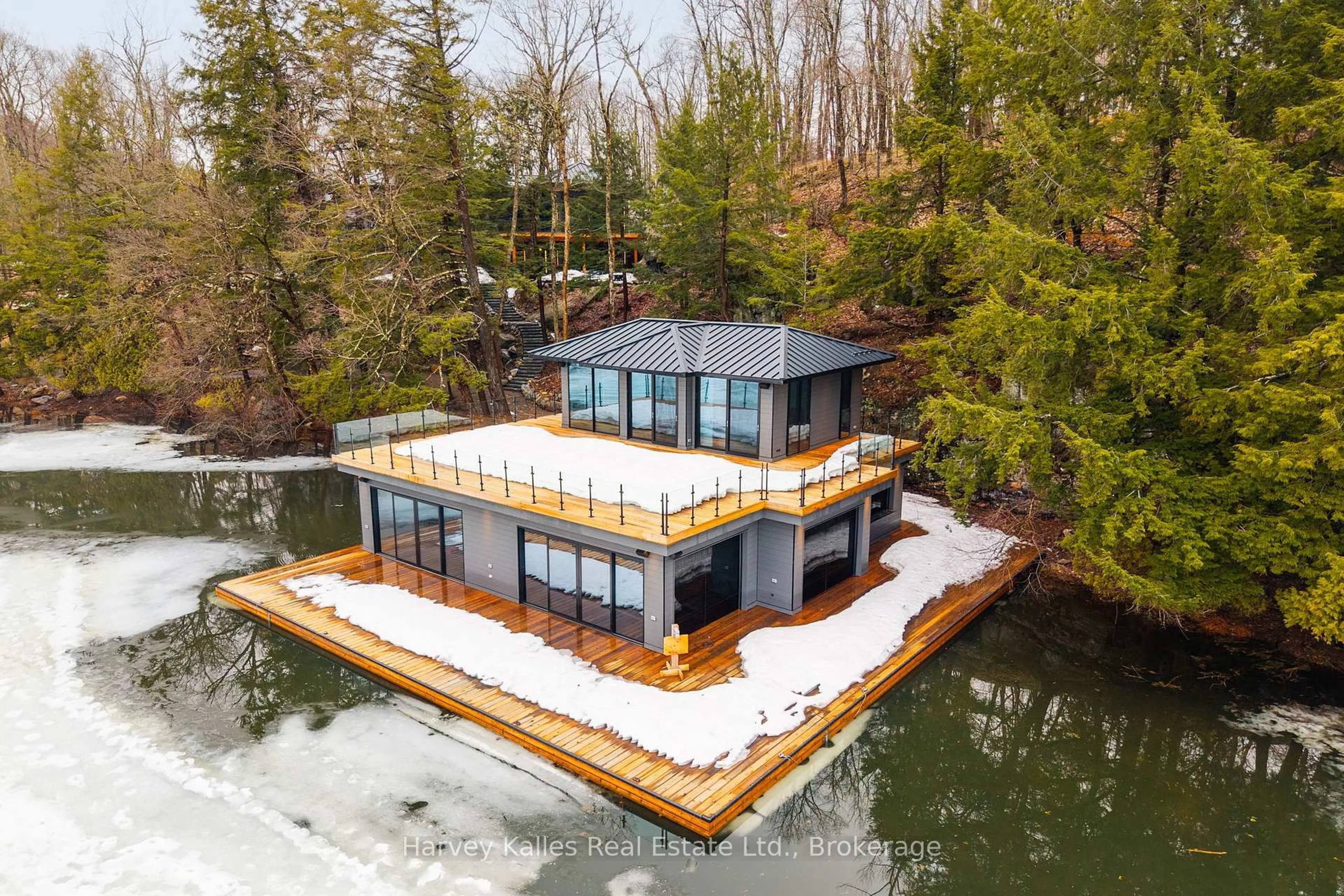 A pic from outside/outdoor area/front of a property/back of a property/a pic from drone, water/lake/river/ocean view for 1013 Hall's Rd #2, Muskoka Lakes Ontario P0B 1J0