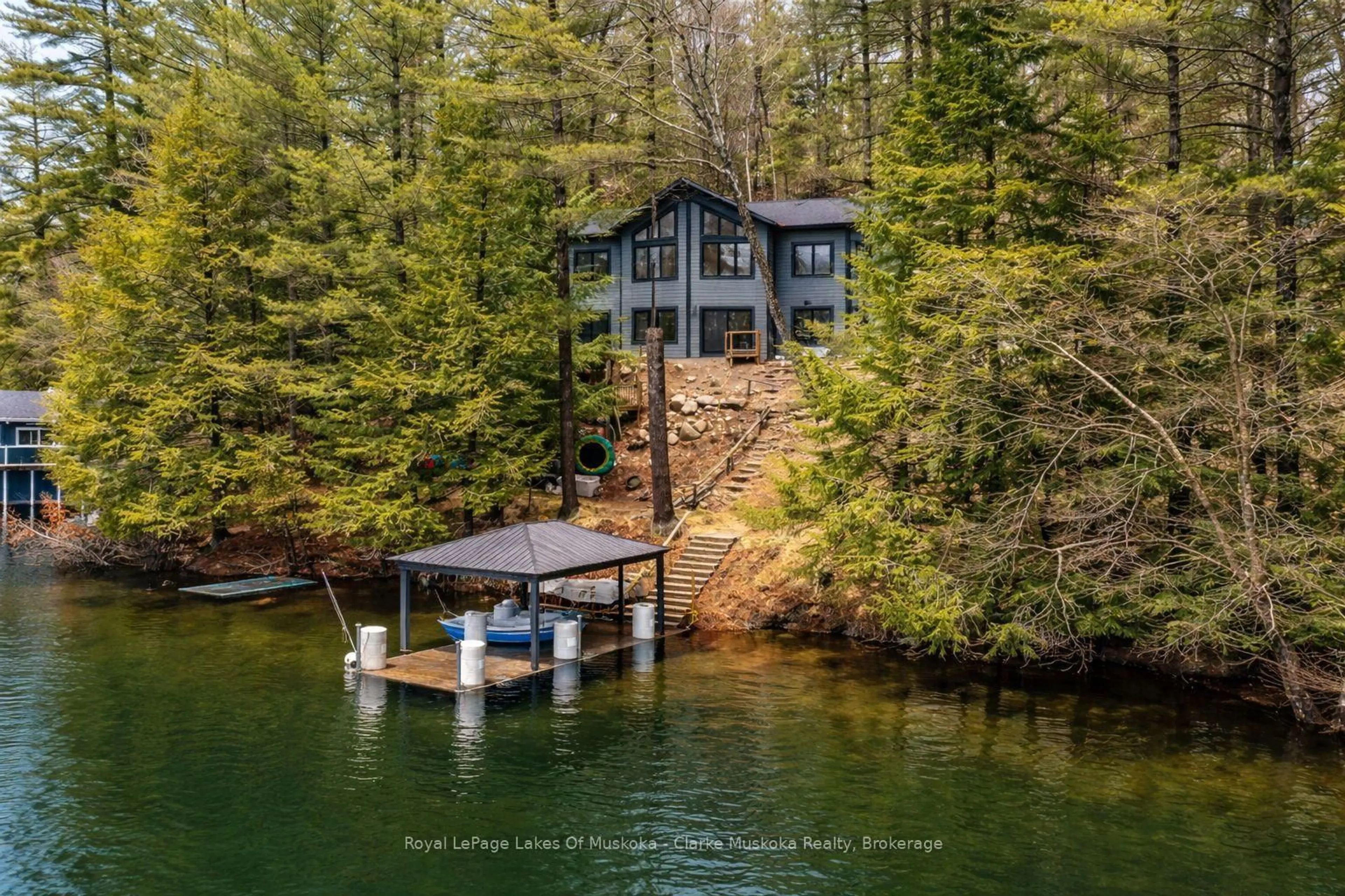A pic from outside/outdoor area/front of a property/back of a property/a pic from drone, water/lake/river/ocean view for 1062 Pennwood Rd #5, Muskoka Lakes Ontario P0B 1J0