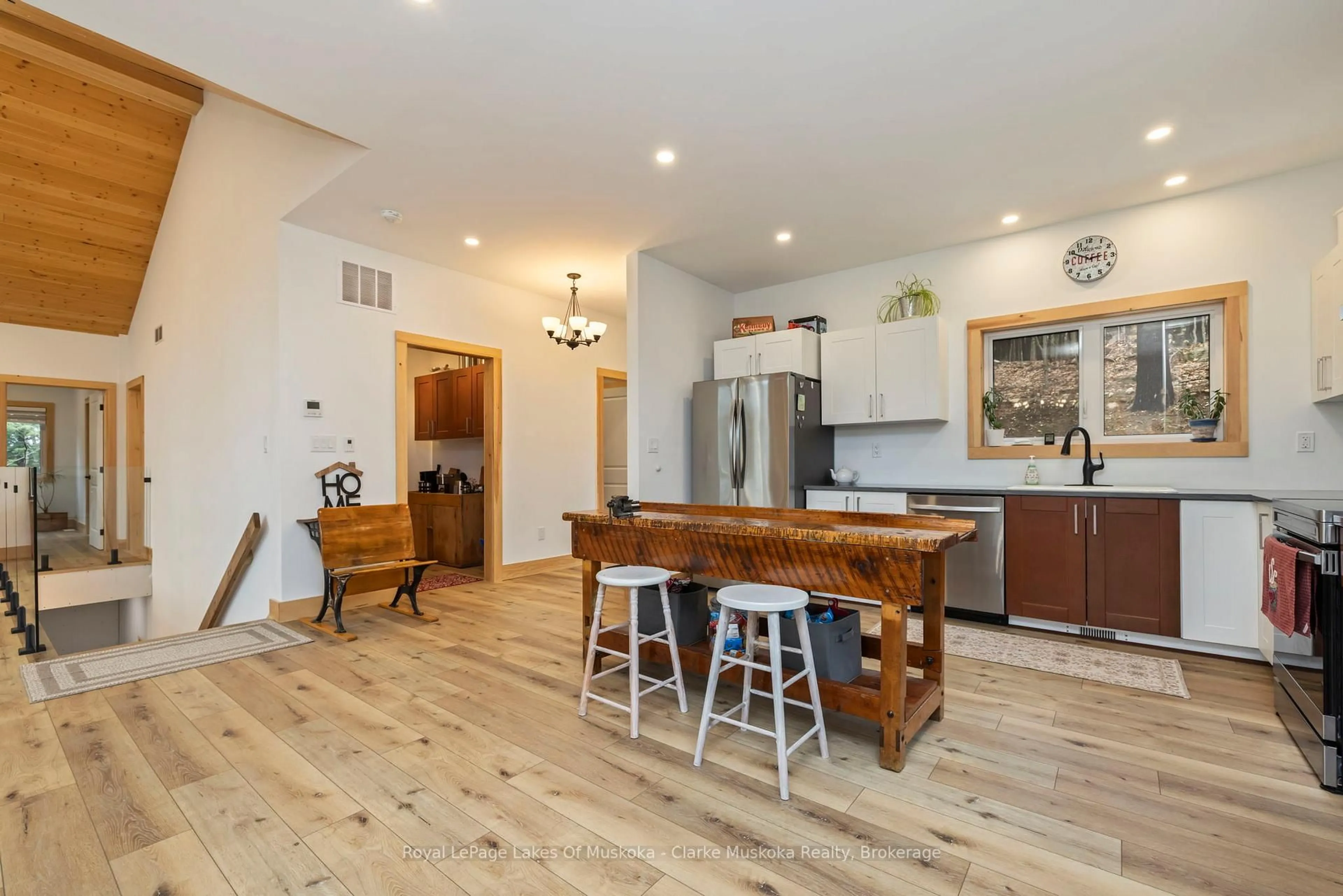 Open concept kitchen, wood/laminate floor for 1062 Pennwood Rd #5, Muskoka Lakes Ontario P0B 1J0