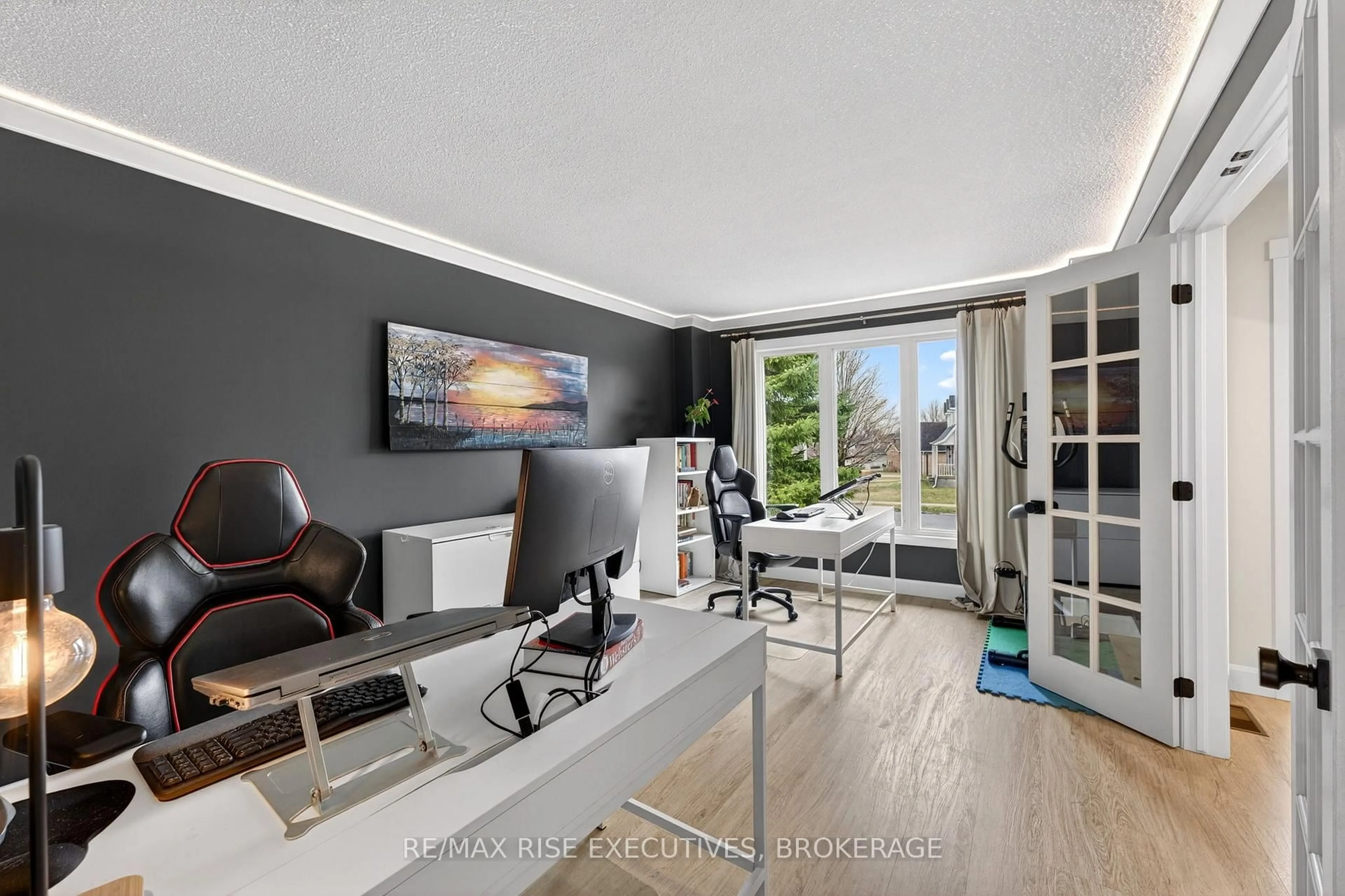 Living room with furniture, wood/laminate floor for 1220 Humberside Dr, Kingston Ontario K7P 2P3