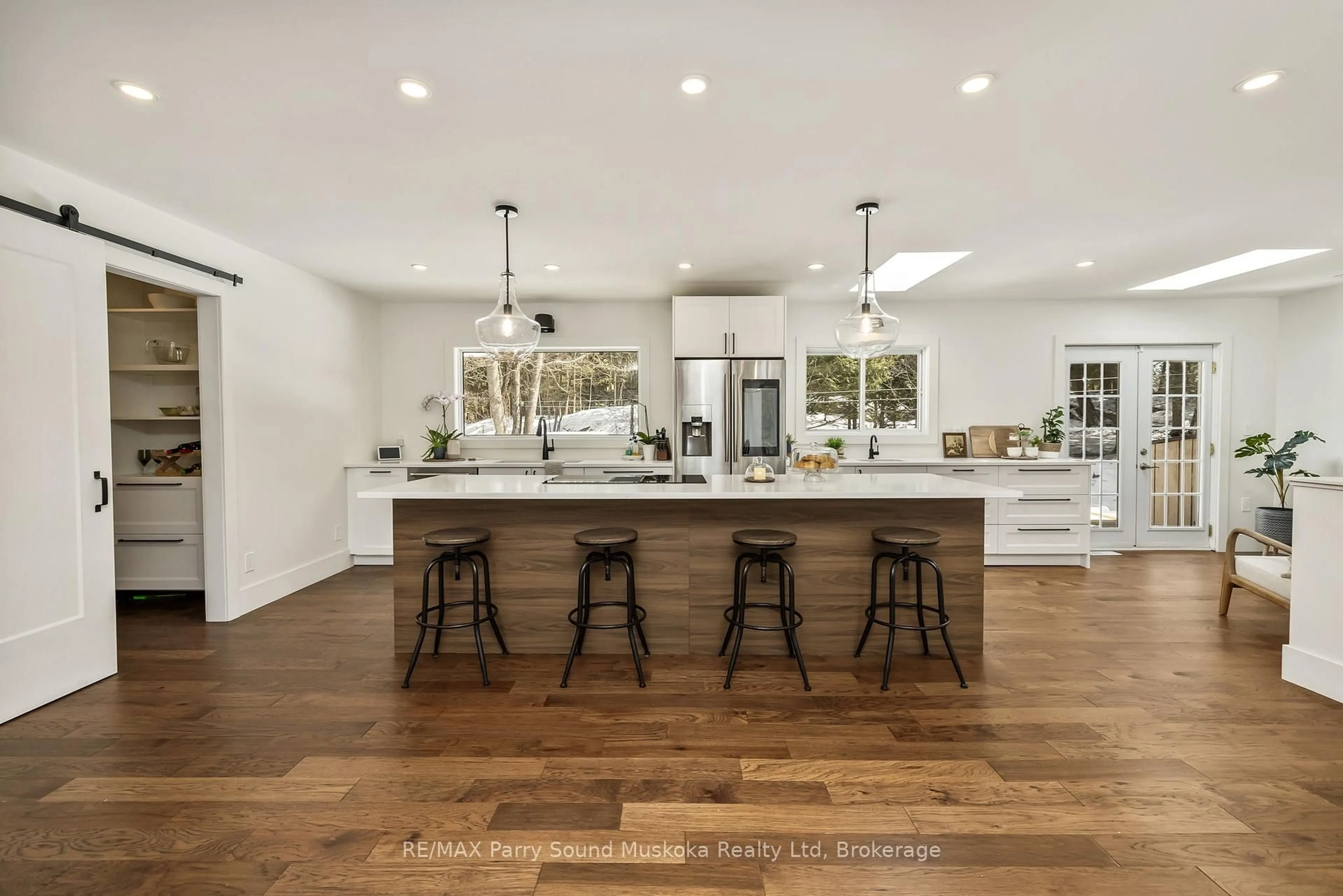 Open concept kitchen, wood/laminate floor for 31 Lake Forest Dr, McDougall Ontario P2A 2W9